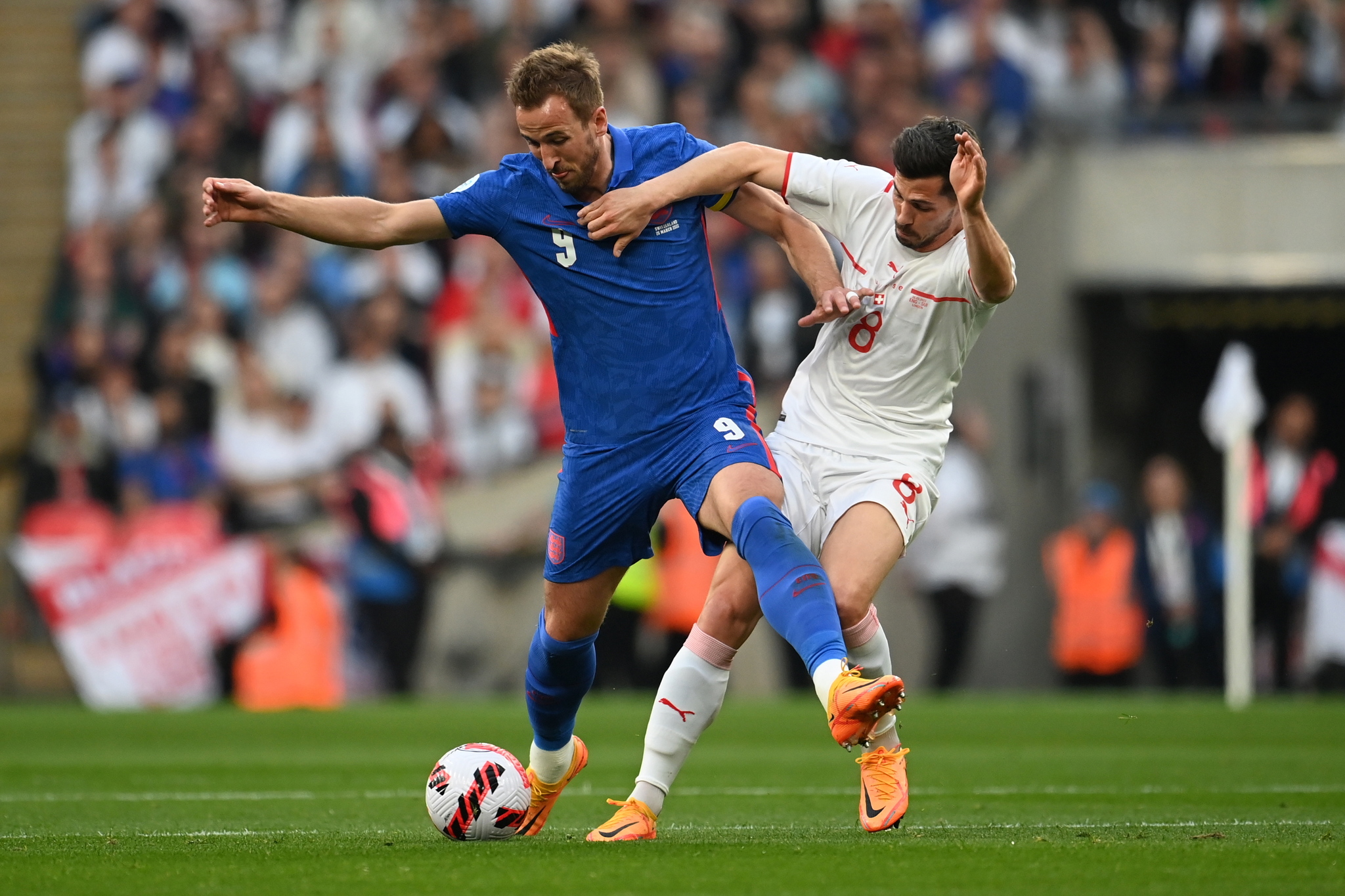 England's Harry Kane and Switzerland's Remo Freuler