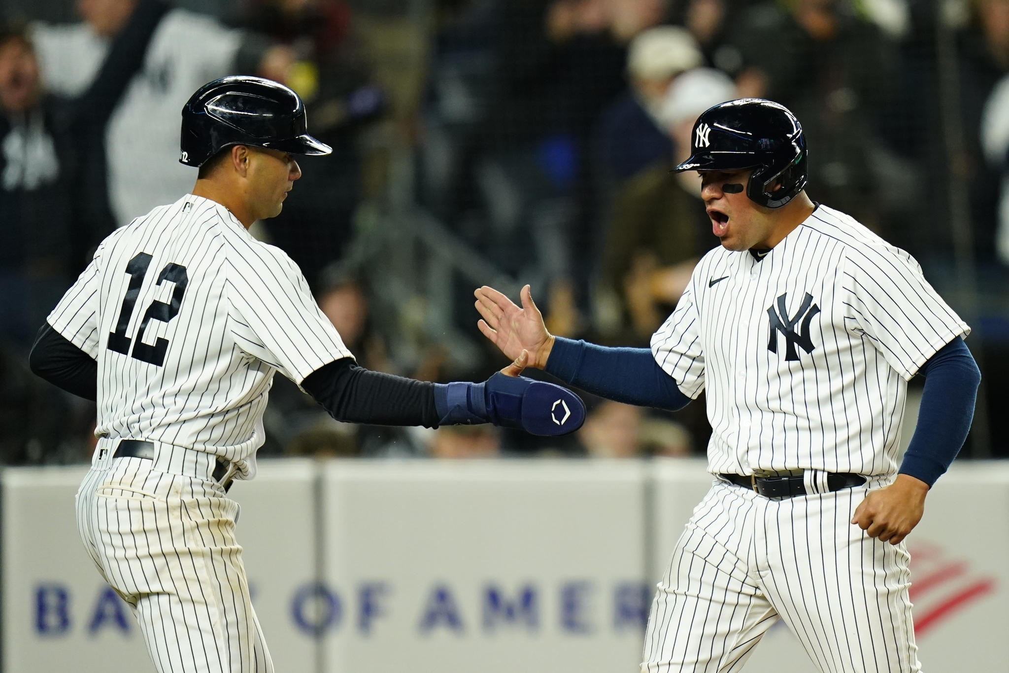 New York  lt;HIT gt;Yankees lt;/HIT gt;' Jose Trevino, right, and Isiah Kiner-Falefa, left, celebrate after they score on a single by Anthony Rizzo during the fourth inning of a baseball game against the Boston Red Sox Sunday, April 10, 2022, in New York. (AP Photo/Frank Franklin II)