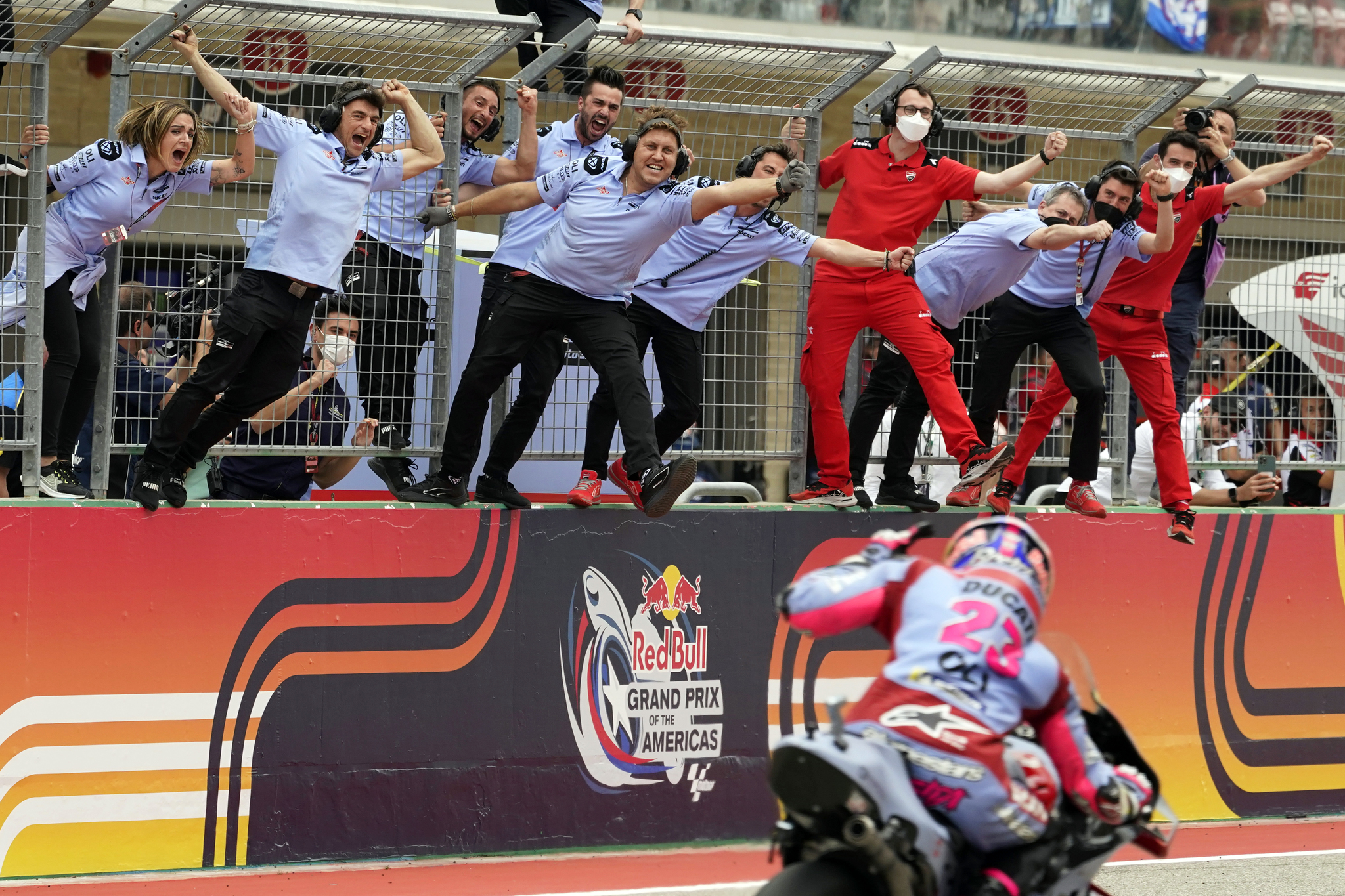 Enea lt;HIT gt;Bastianini lt;/HIT gt; (23), of Italy, celebrates with his team as he wins the MotoGP Grand Prix of the Americas motorcycle race at the Circuit of the Americas, Sunday, April 10, 2022, in Austin, Texas. (AP Photo/Eric Gay)