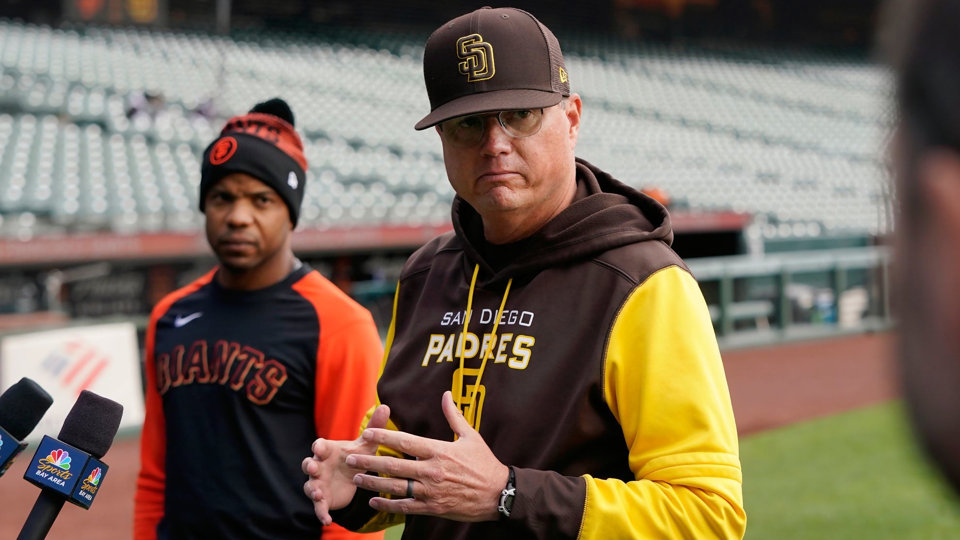Giants coach Antoan Richardson and Padres coach Mike Shildt.