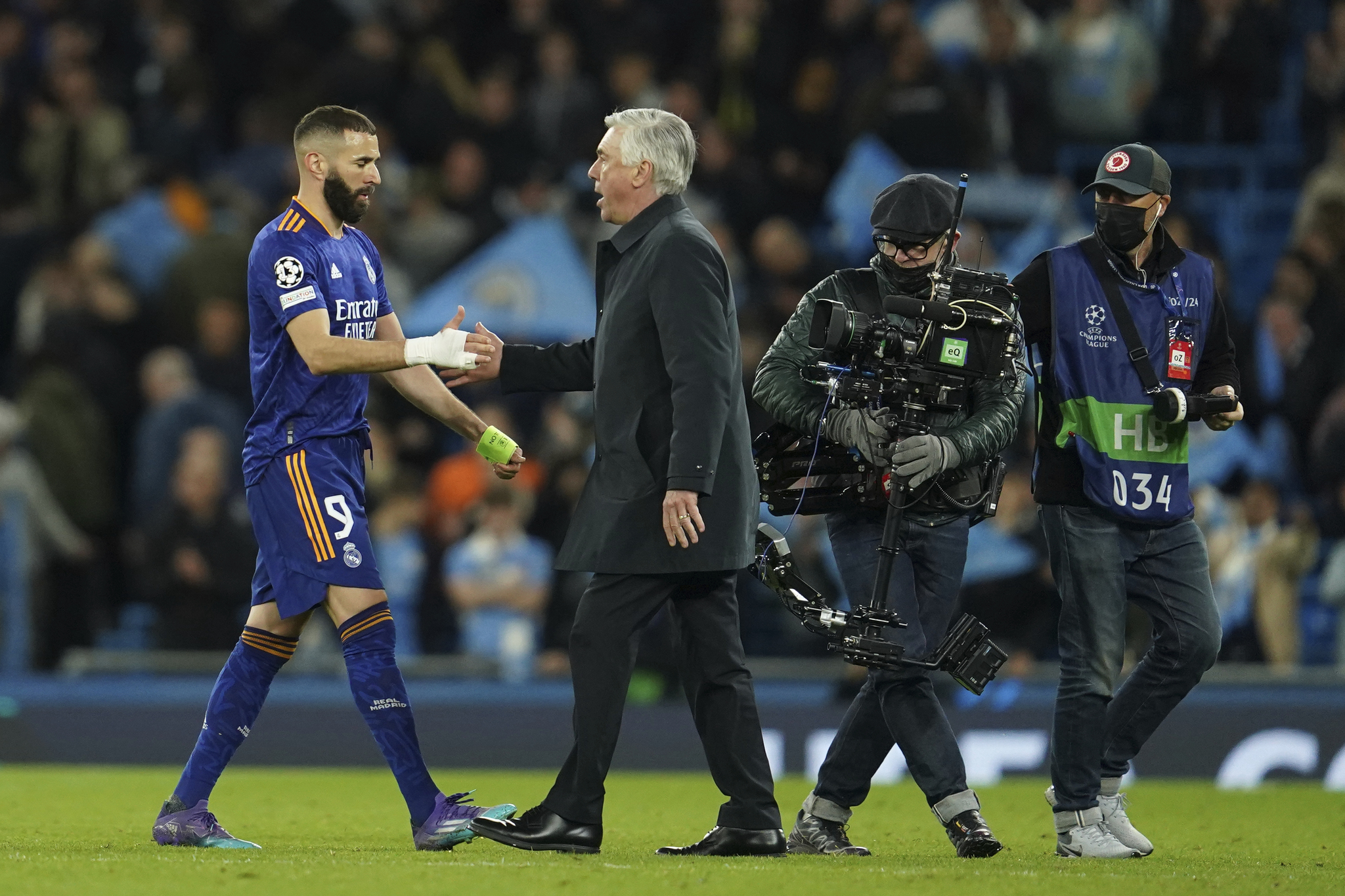 Carlo Ancelotti greets Karim Benzema at the end of the Champions League semi final, first leg soccer match.