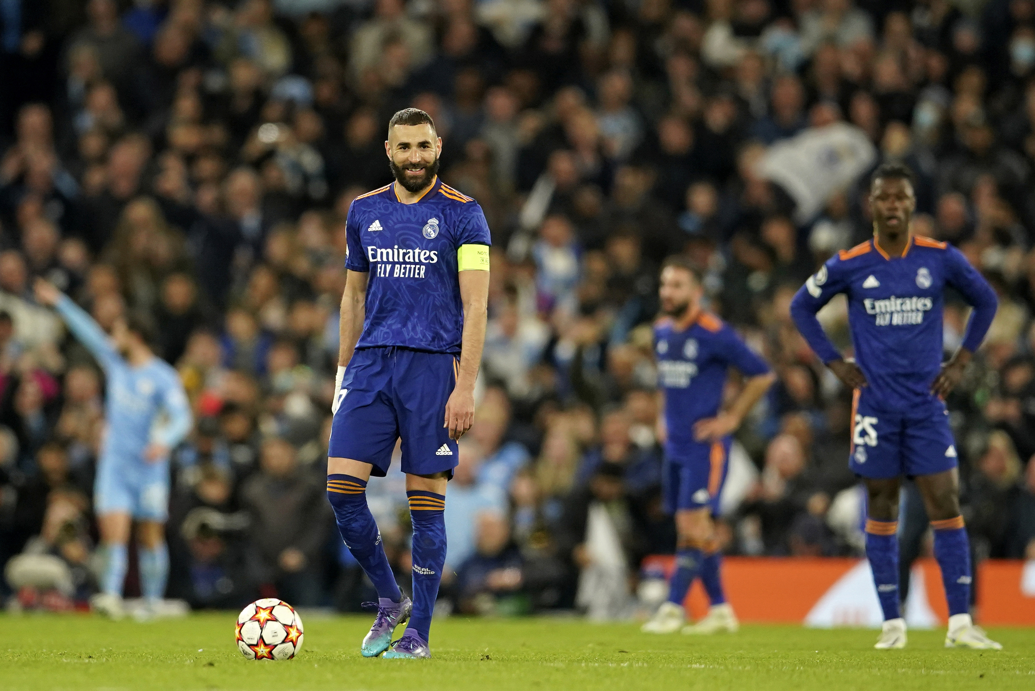 Karim Benzema reacts after Manchester City's Bernardo Silva scoring his side's fourth goal.
