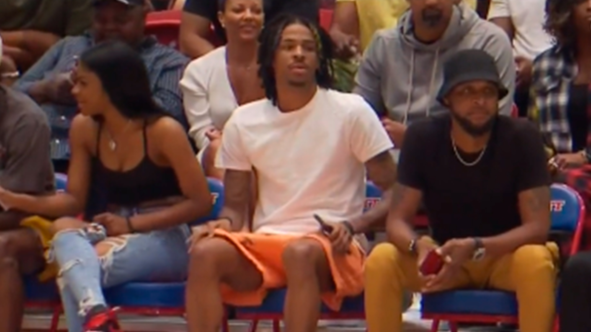 Ja Morant sits courtside at Iverson Classic