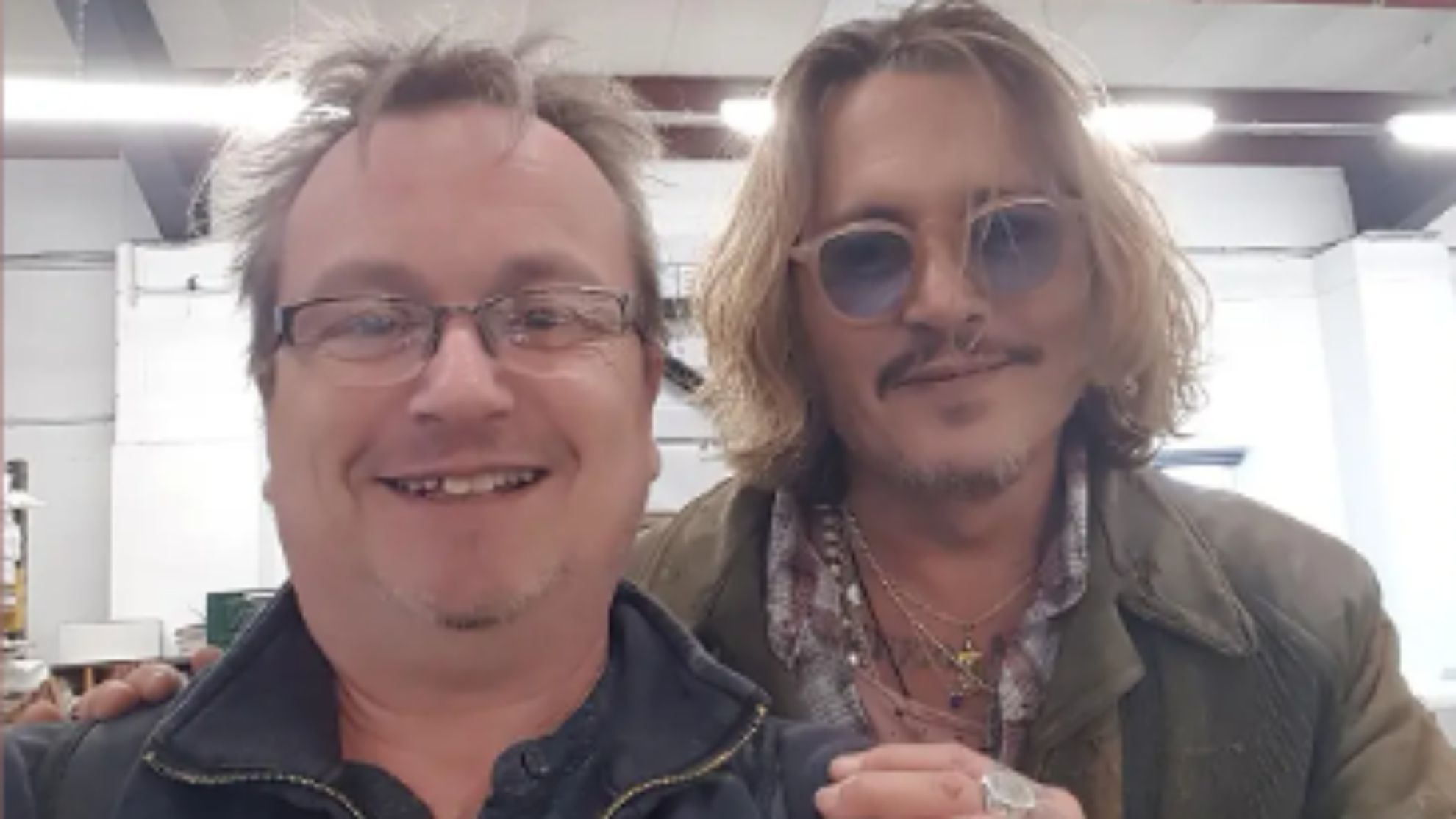 Johnny Depp and a fan in Sussex, England.