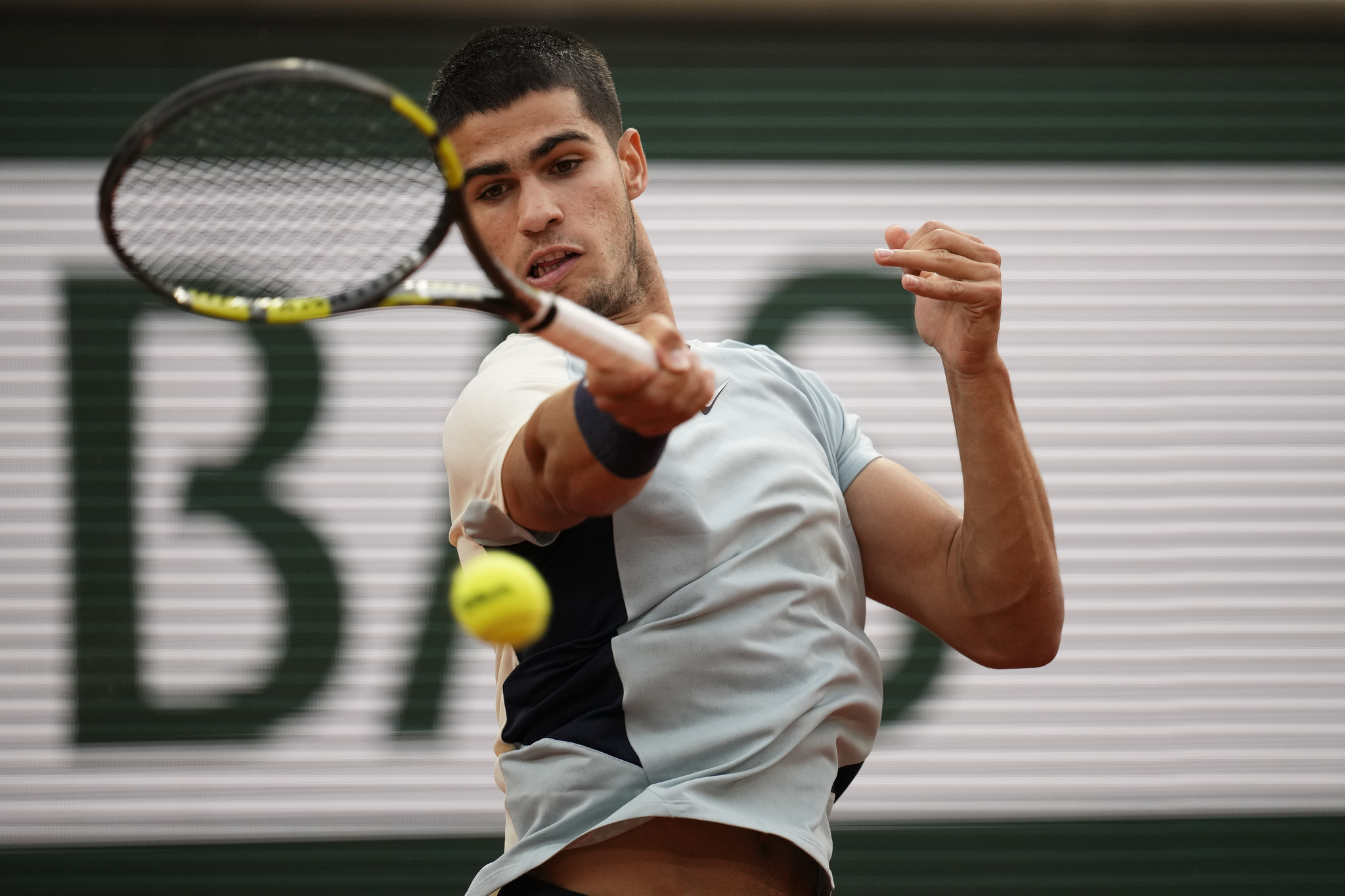 Spain's Carlos  lt;HIT gt;Alcaraz lt;/HIT gt; plays a shot against Argentina's Juan Ignacio Londero during their first round match at the French Open tennis tournament in Roland Garros stadium in Paris, France, Sunday, May 22, 2022. (AP Photo/Christophe Ena)