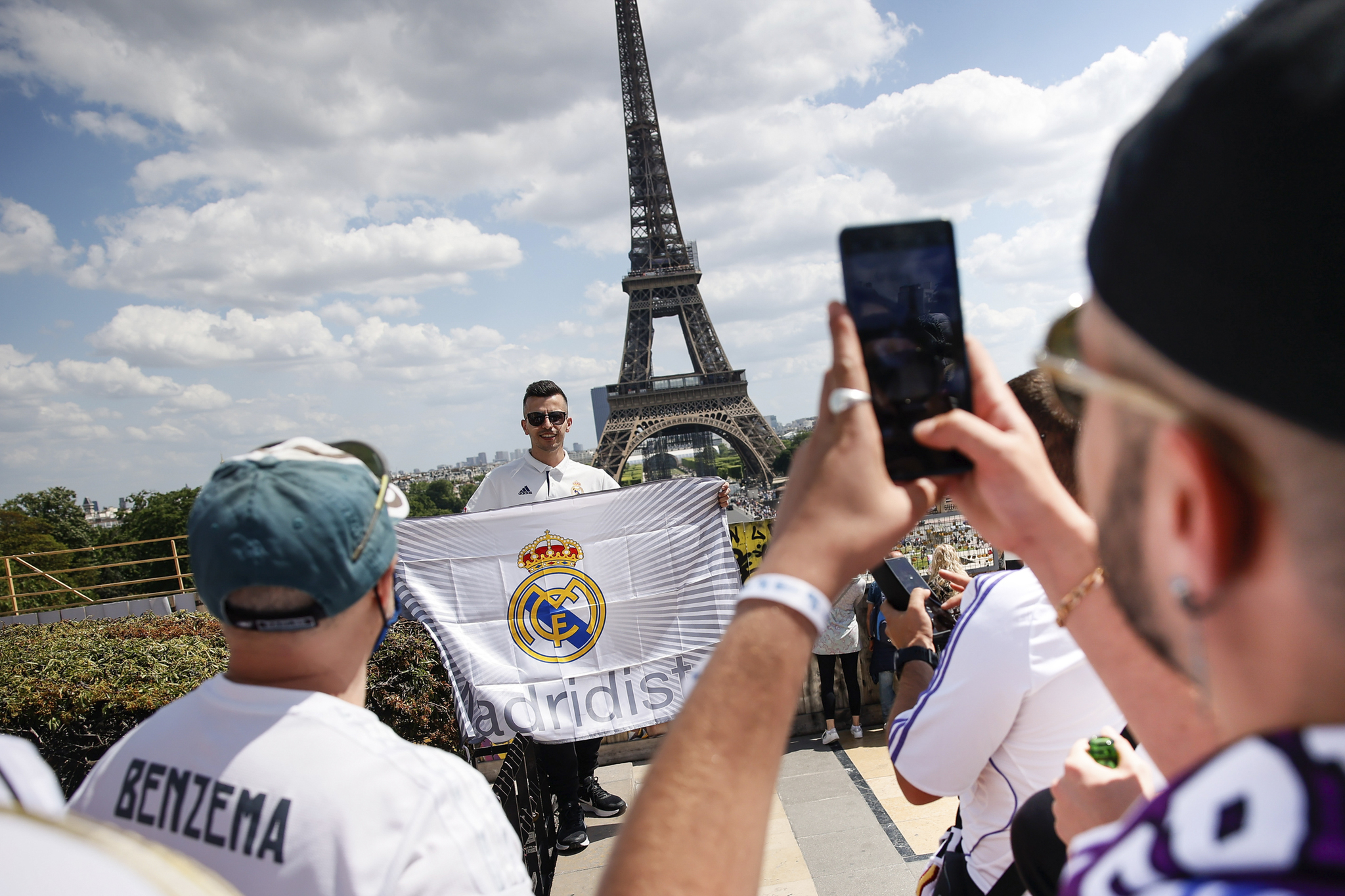 Real Madrid supporters pose for a photograph near the Eiffel Tower in Paris, Saturday, May 28, 2022 ahead of Saturday's  lt;HIT gt;Champions lt;/HIT gt;  lt;HIT gt;League lt;/HIT gt; final soccer match between Liverpool and Real Madrid at the Stade de France. (AP Photo/Thomas Padilla)