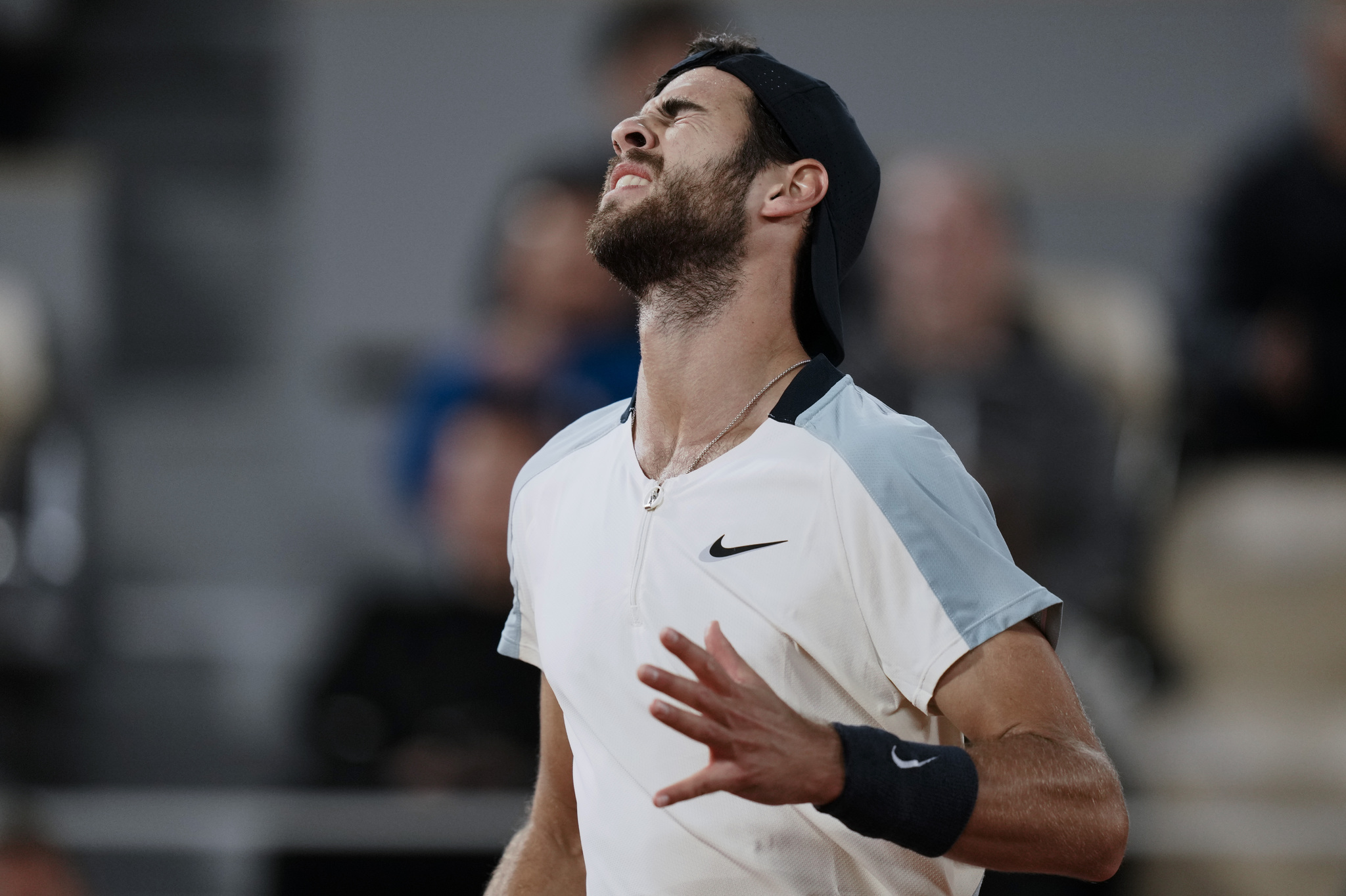 Russia's Karen  lt;HIT gt;Khachanov lt;/HIT gt; reacts after missing a shot against Spain's Carlos Alcaraz during their fourth round match at the French Open tennis tournament in Roland Garros stadium in Paris, France, Sunday, May 29, 2022. (AP Photo/Thibault Camus)