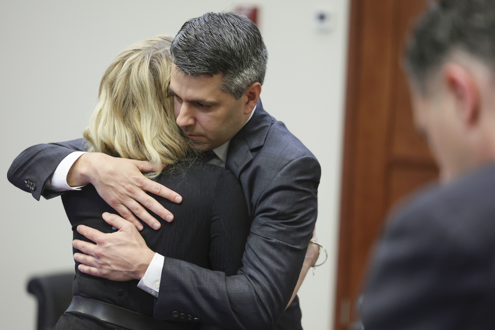 Actor Amber Heard hugs her attorney Benjamin Rottenborn after the verdict was read at the Fairfax County Circuit Courthouse in Fairfax, Va, Wednesday, June 1, 2022. The jury awarded Johnny  lt;HIT gt;Depp lt;/HIT gt; more than $10 million in his libel lawsuit against ex-wife Amber Heard. It vindicates his stance that Heard fabricated claims that she was abused by  lt;HIT gt;Depp lt;/HIT gt; before and during their brief marriage. But the jury also found in favor of Heard, who said she was defamed by a lawyer for  lt;HIT gt;Depp lt;/HIT gt;.(Evelyn Hockstein/Pool via AP)