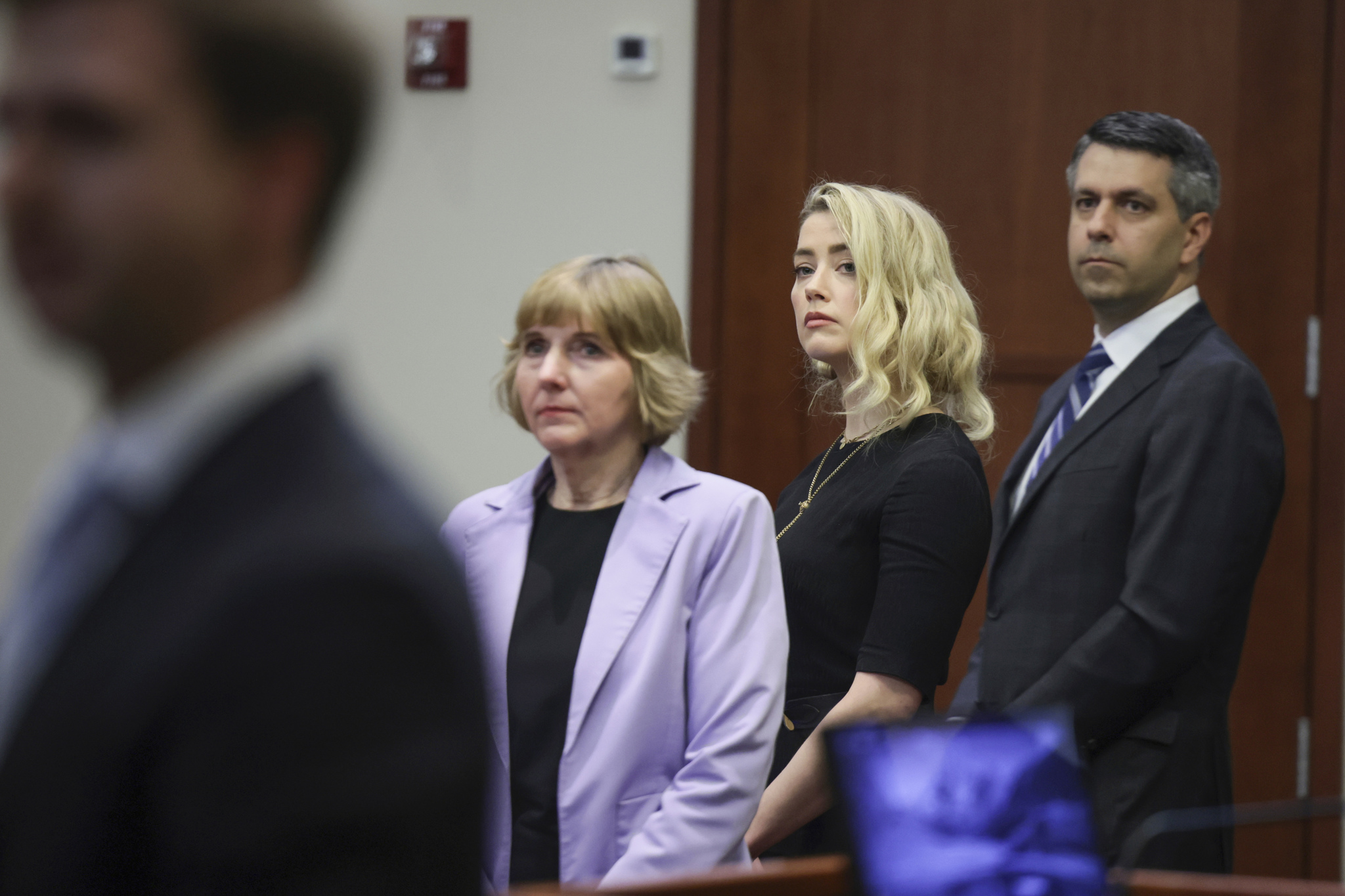 Actor  lt;HIT gt;Amber lt;/HIT gt;  lt;HIT gt;Heard lt;/HIT gt; stands with her lawyers Elaine Bredehoft and Benjamin Rottenborn before the verdict was read at the Fairfax County Circuit Courthouse in Fairfax, Va, Wednesday, June 1, 2022. The jury awarded Johnny Depp more than $10 million in his libel lawsuit against ex-wife  lt;HIT gt;Amber lt;/HIT gt;  lt;HIT gt;Heard lt;/HIT gt;. It vindicates his stance that  lt;HIT gt;Heard lt;/HIT gt; fabricated claims that she was abused by Depp before and during their brief marriage. But the jury also found in favor of  lt;HIT gt;Heard lt;/HIT gt;, who said she was defamed by a lawyer for Depp.(Evelyn Hockstein/Pool via AP)