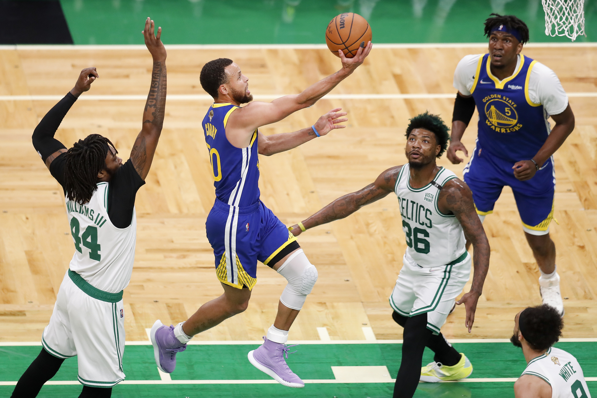 Golden State Warriors guard Stephen Curry (30) goes up for a shot against Boston  lt;HIT gt;Celtics lt;/HIT gt; guard Marcus Smart (36) and center Robert Williams III (44) during the first quarter of Game 6 of basketball's NBA Finals, Thursday, June 16, 2022, in Boston. (AP Photo/Michael Dwyer)