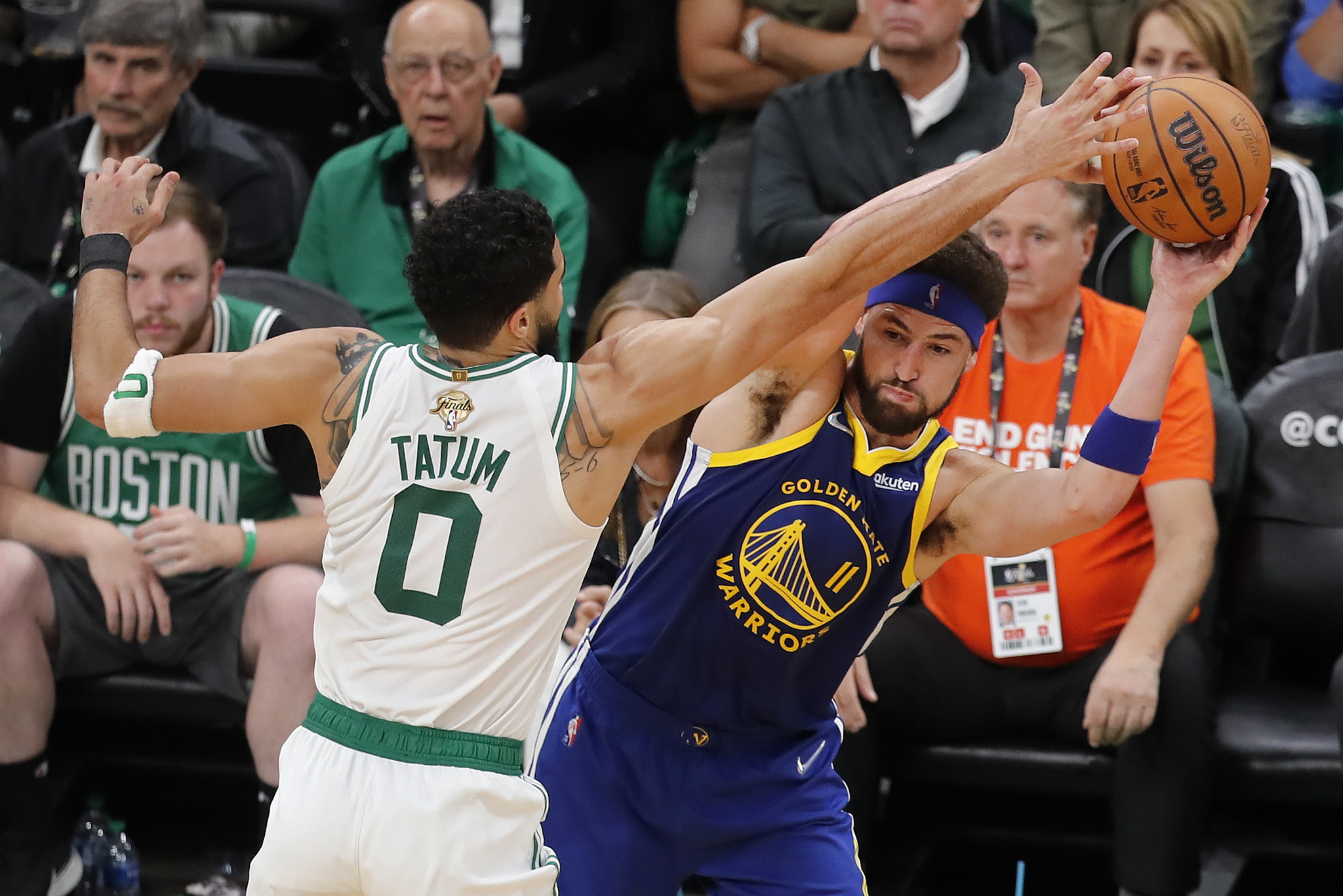 Golden State  lt;HIT gt;Warriors lt;/HIT gt; guard Klay Thompson (11) looks to pass against the Boston Celtics forward Jayson Tatum (0) during the third quarter of Game 6 of basketball's NBA Finals, Thursday, June 16, 2022, in Boston. (AP Photo/Michael Dwyer)