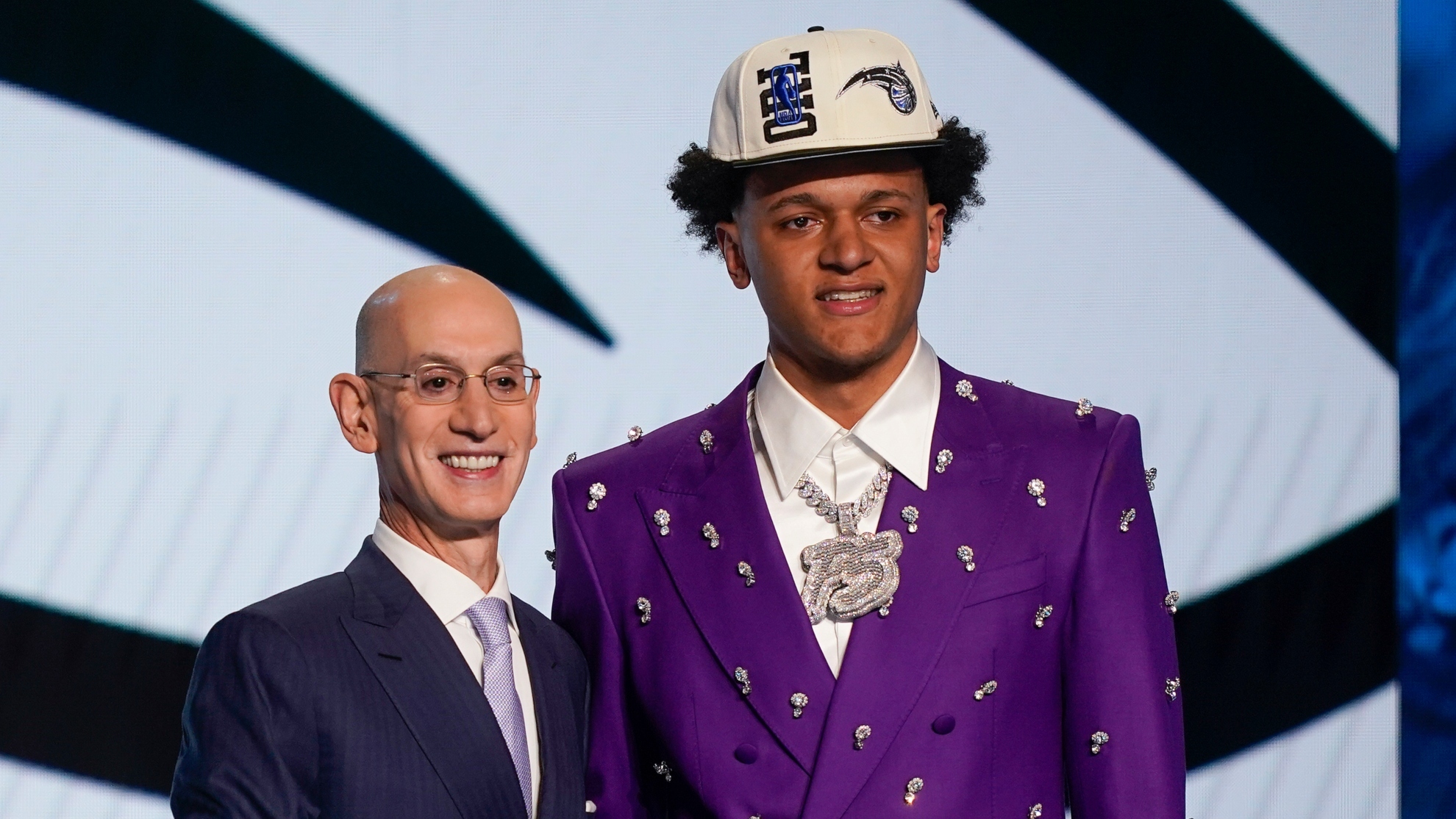 Paolo Banchero, right, poses for a photo with NBA Commissioner Adam Silver after being selected as the number one pick overall by the Orlando Magic in the NBA basketball draft