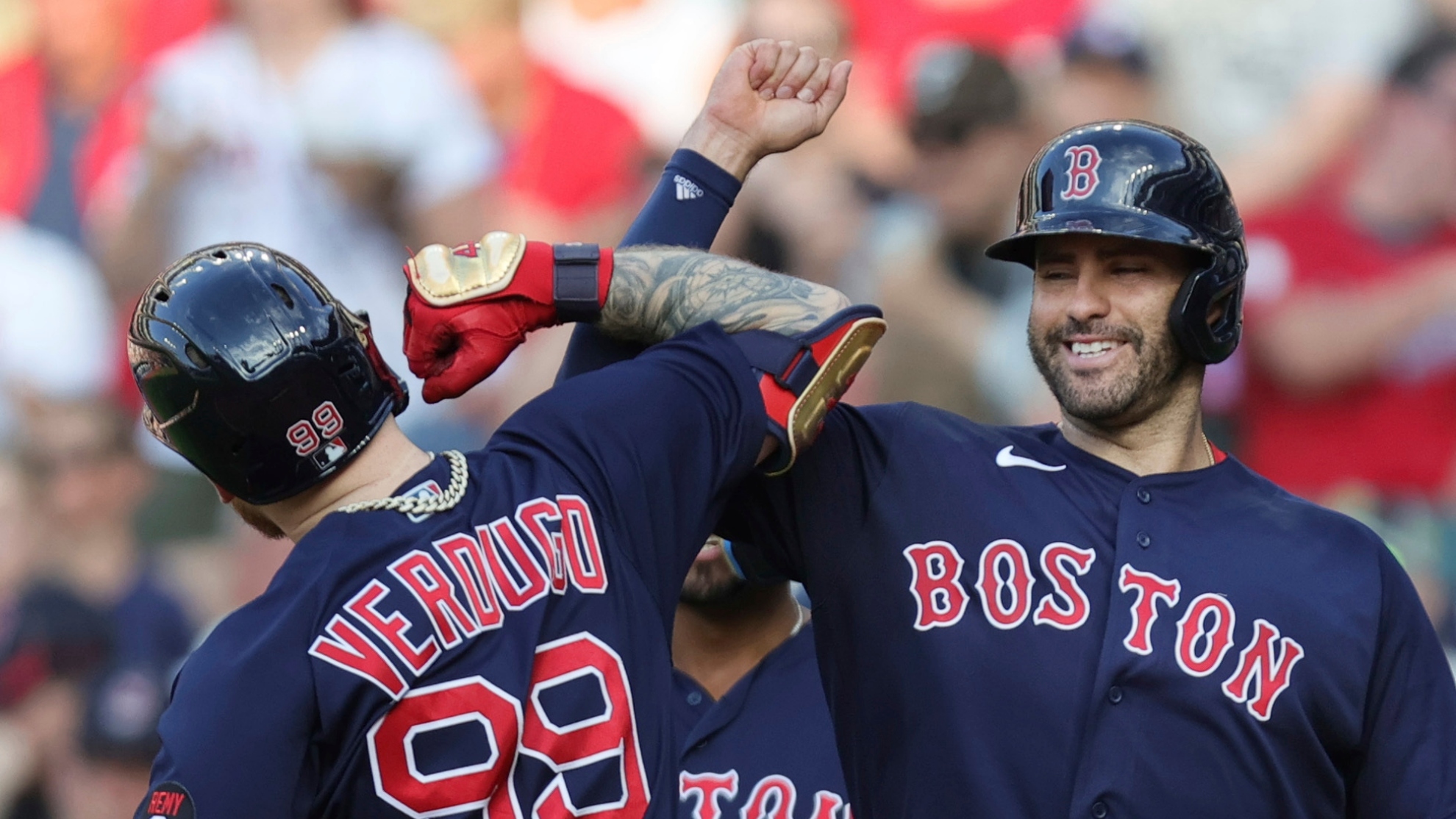 Boston Red Sox's J.D. Martinez, right, celebrates a three-run home run by Alex Verdugo (99) against the Cleveland Guardians during the sixth inning of a baseball game Saturday, June 25, 2022, in Cleveland. (John Kuntz/Cleveland.com via AP)