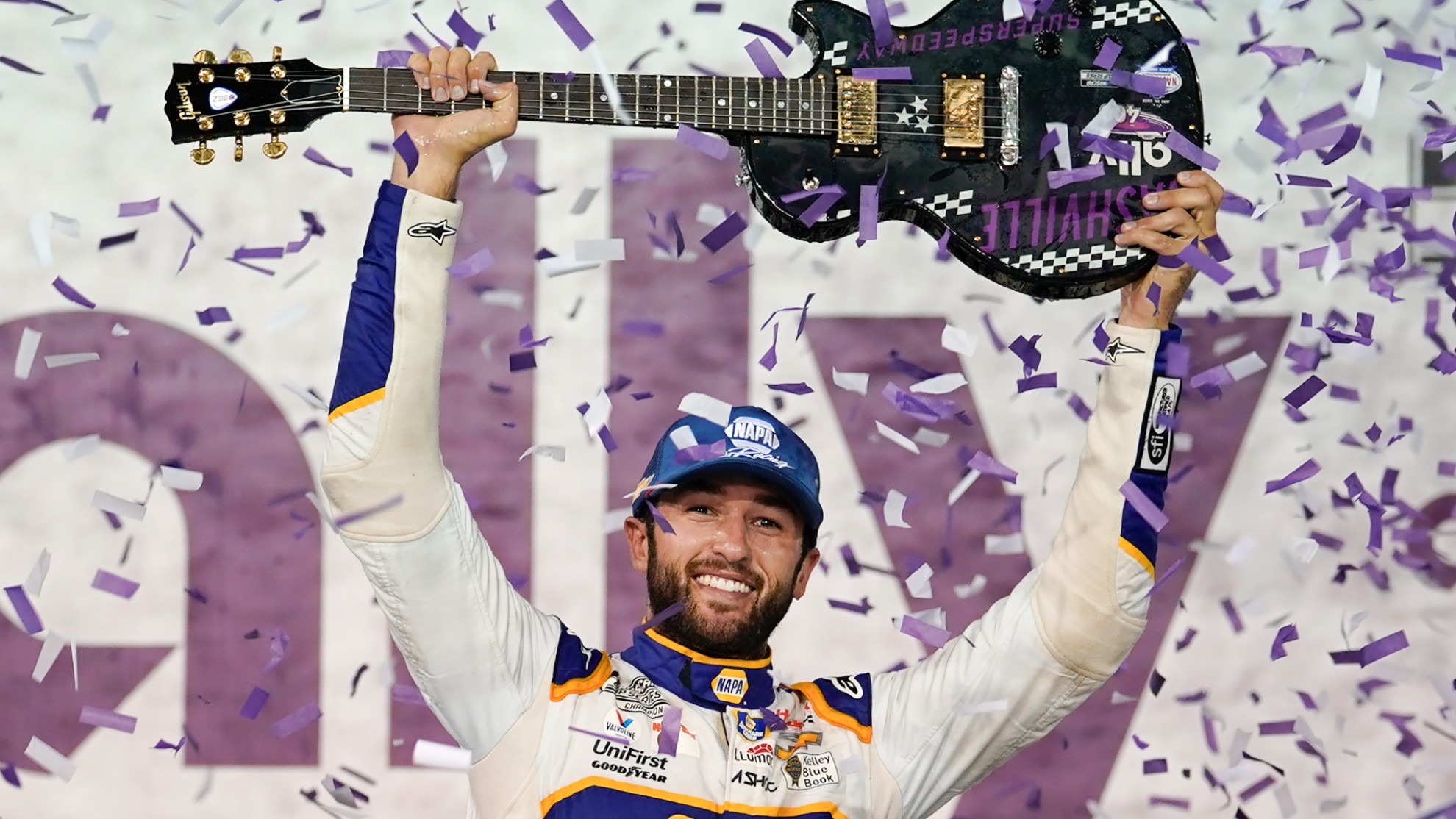 Chase Elliott holds the guitar presented to him after winning a NASCAR Cup Series auto race Sunday.