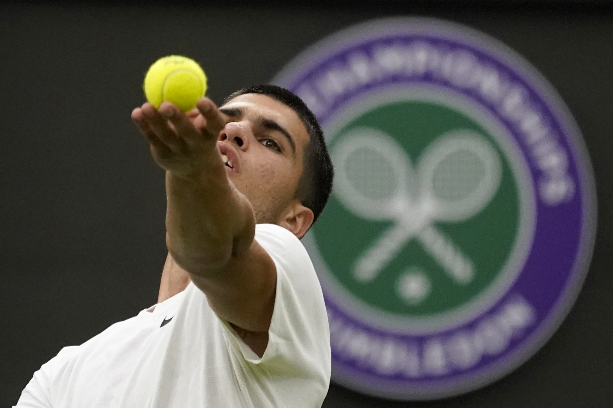 Spain's Carlos Alcaraz serves to Germany's Jan-Lennard  lt;HIT gt;Struff lt;/HIT gt; during their men's singles tennis match on day one of the Wimbledon tennis championships in London, Monday, June 27, 2022. (AP Photo/Alberto Pezzali)