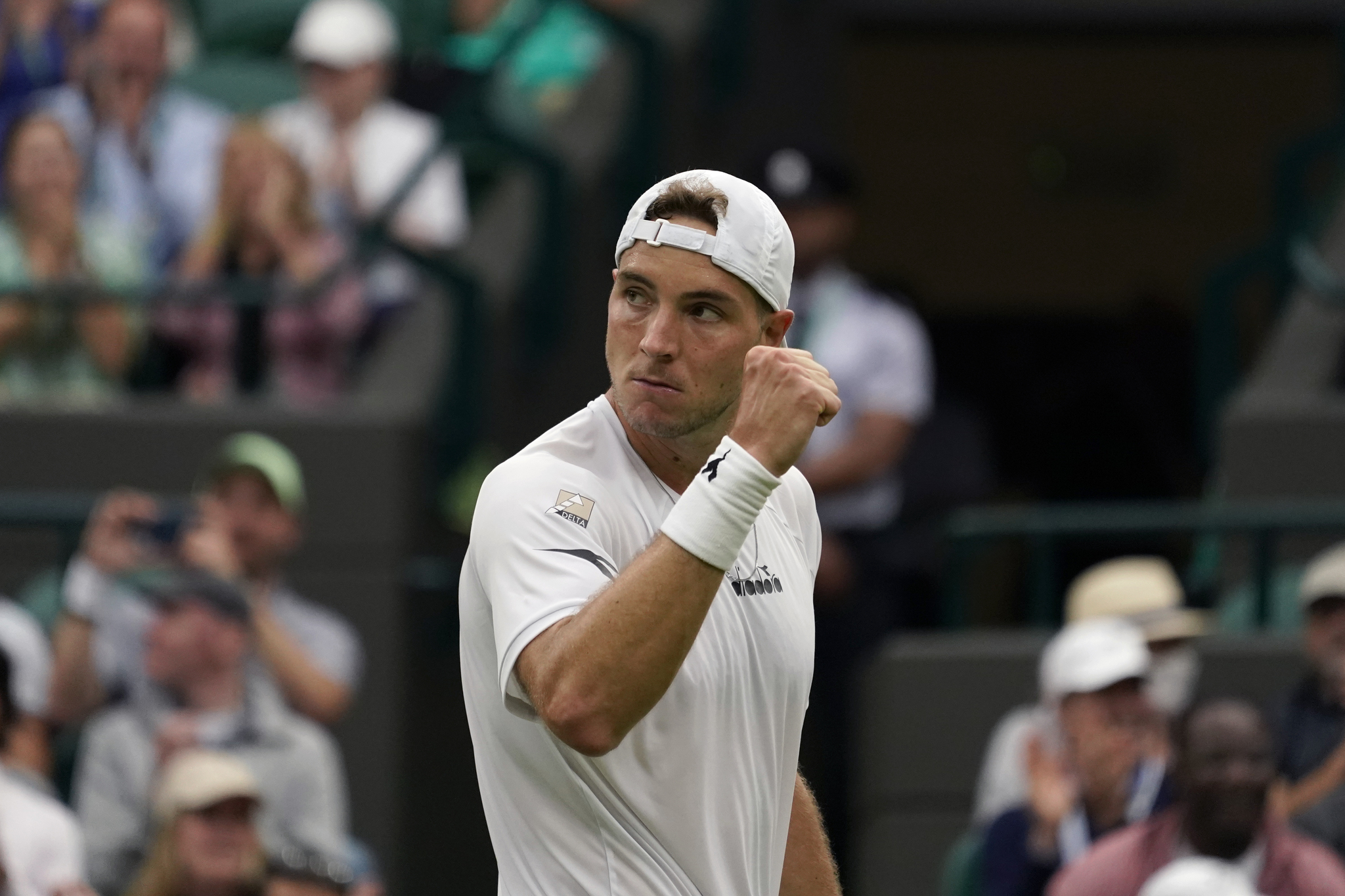 Germany's Jan-Lennard  lt;HIT gt;Struff lt;/HIT gt; reacts after winning a point against Spain's Carlos Alcaraz during their men's singles tennis match on day one of the Wimbledon tennis championships in London, Monday, June 27, 2022. (AP Photo/Alberto Pezzali)