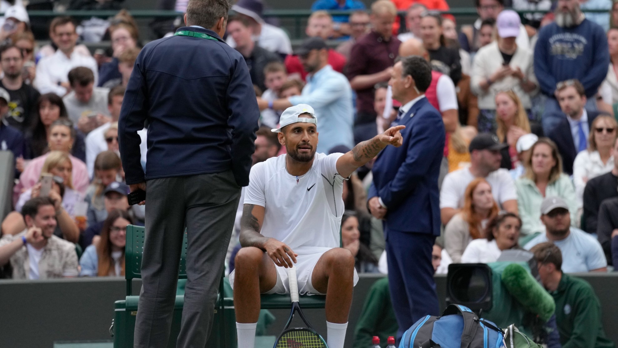 Nick Kyrgios talks to an official during a third round men's singles match against Greece's Stefanos Tsitsipas.