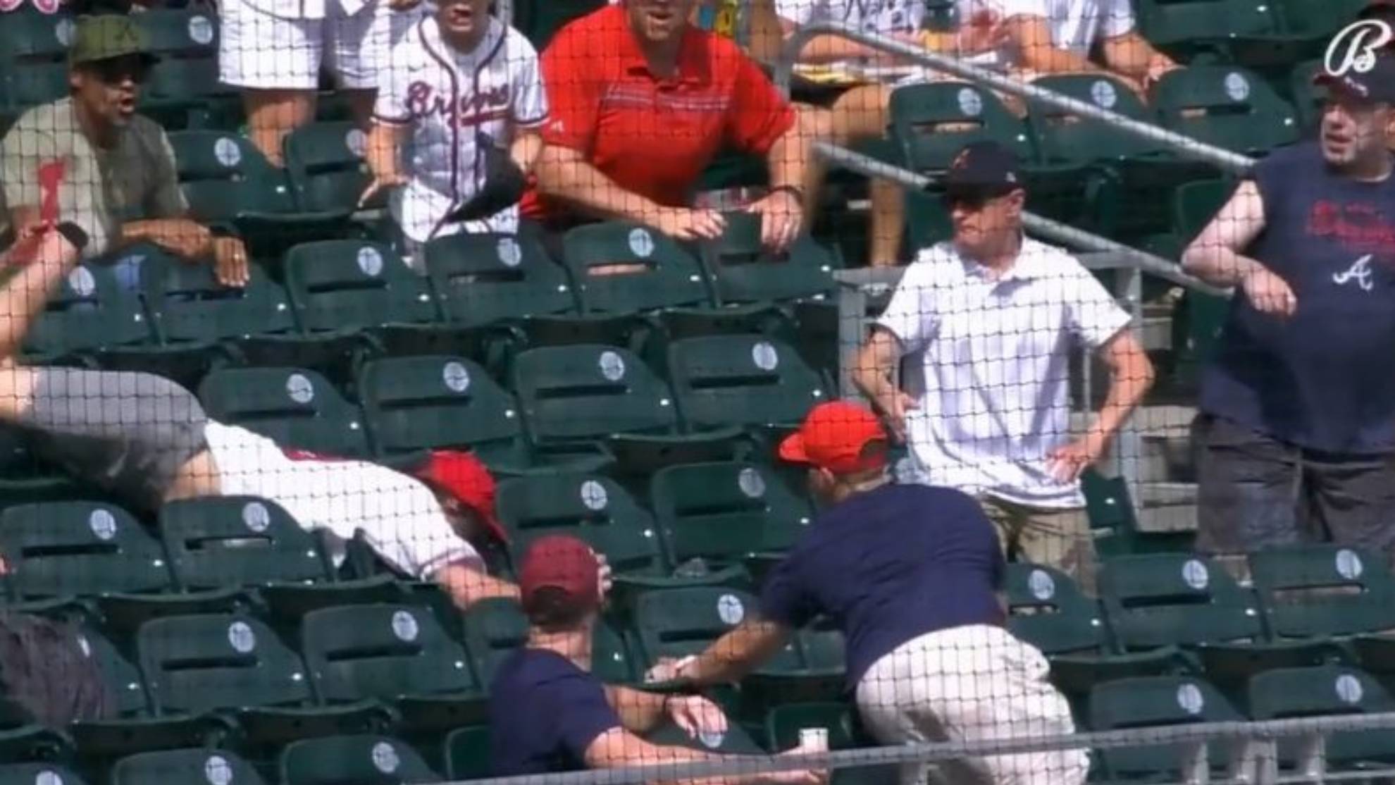 Braves fan nearly breaks his face catching a foul ball (VIDEO)