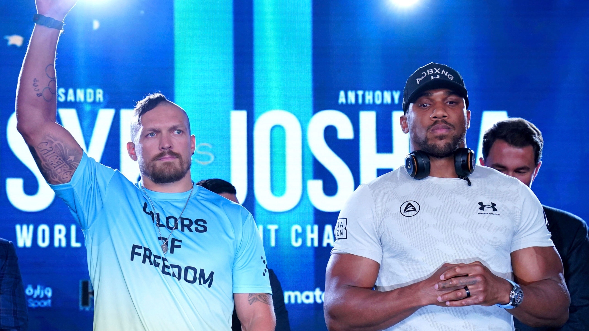 Boxers Oleksandr Usyk, left, and Anthony Joshua pose during a press conference