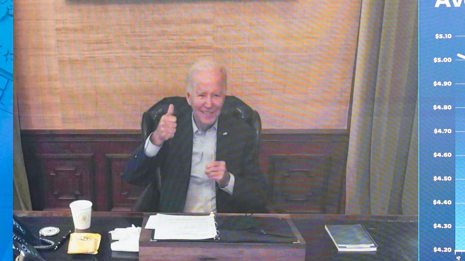 President Joe Biden gives a thumbs up after being asked by members of the media how he is feeling.