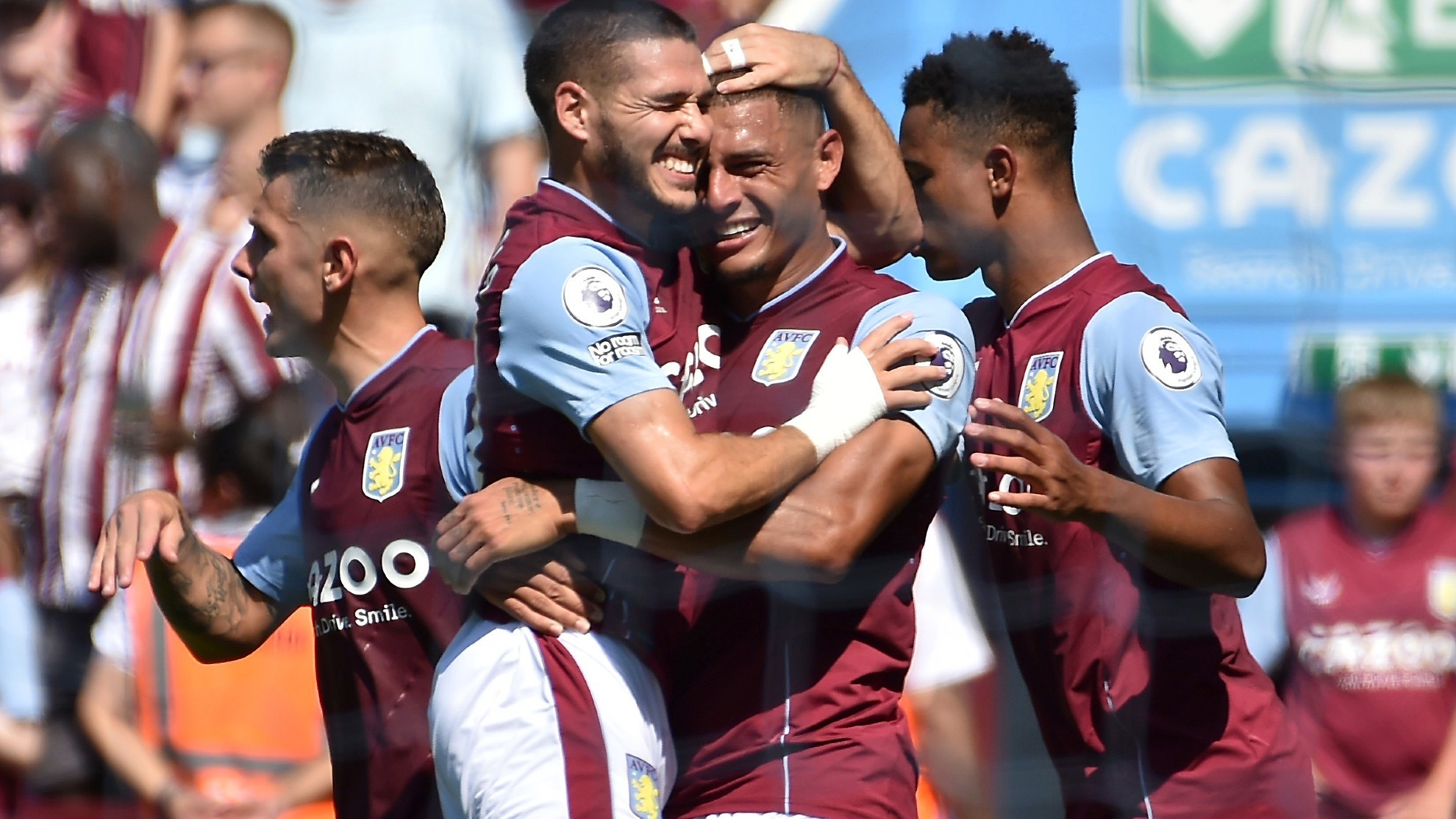 Aston Villa's Emiliano Buendia, centre left, celebrates with teammate Diego Carlos after scoring