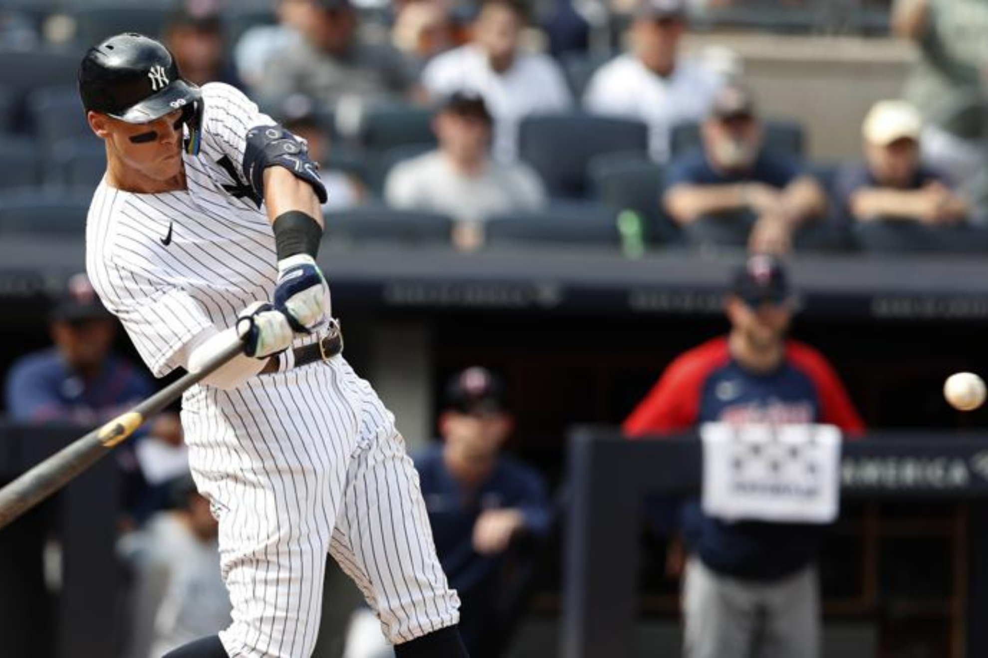 Aaron Judge batting a home run for the Yankees against the Twins - AP Photo/Noah K. Murray