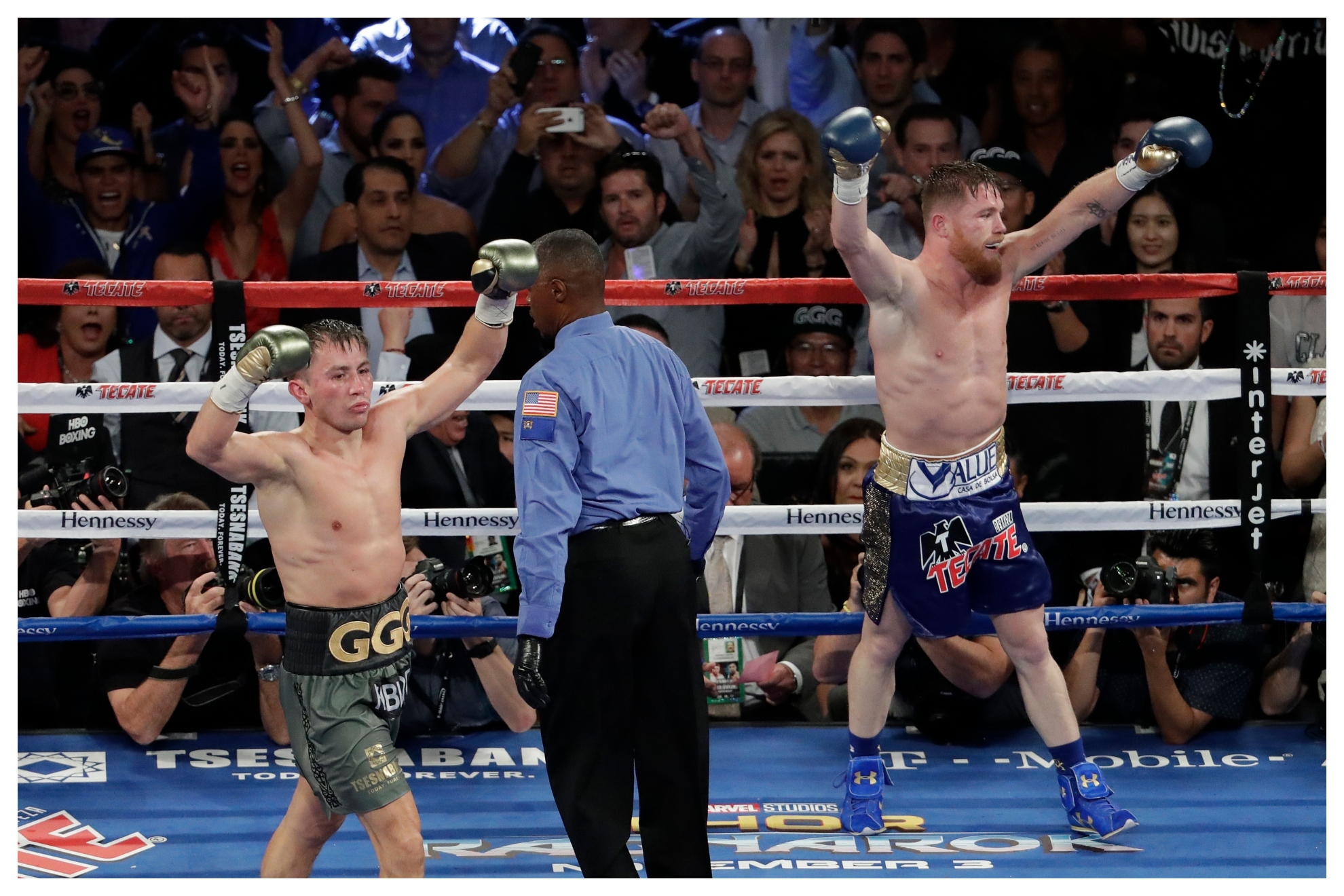 Golovkin and Canelo in the ring / AP