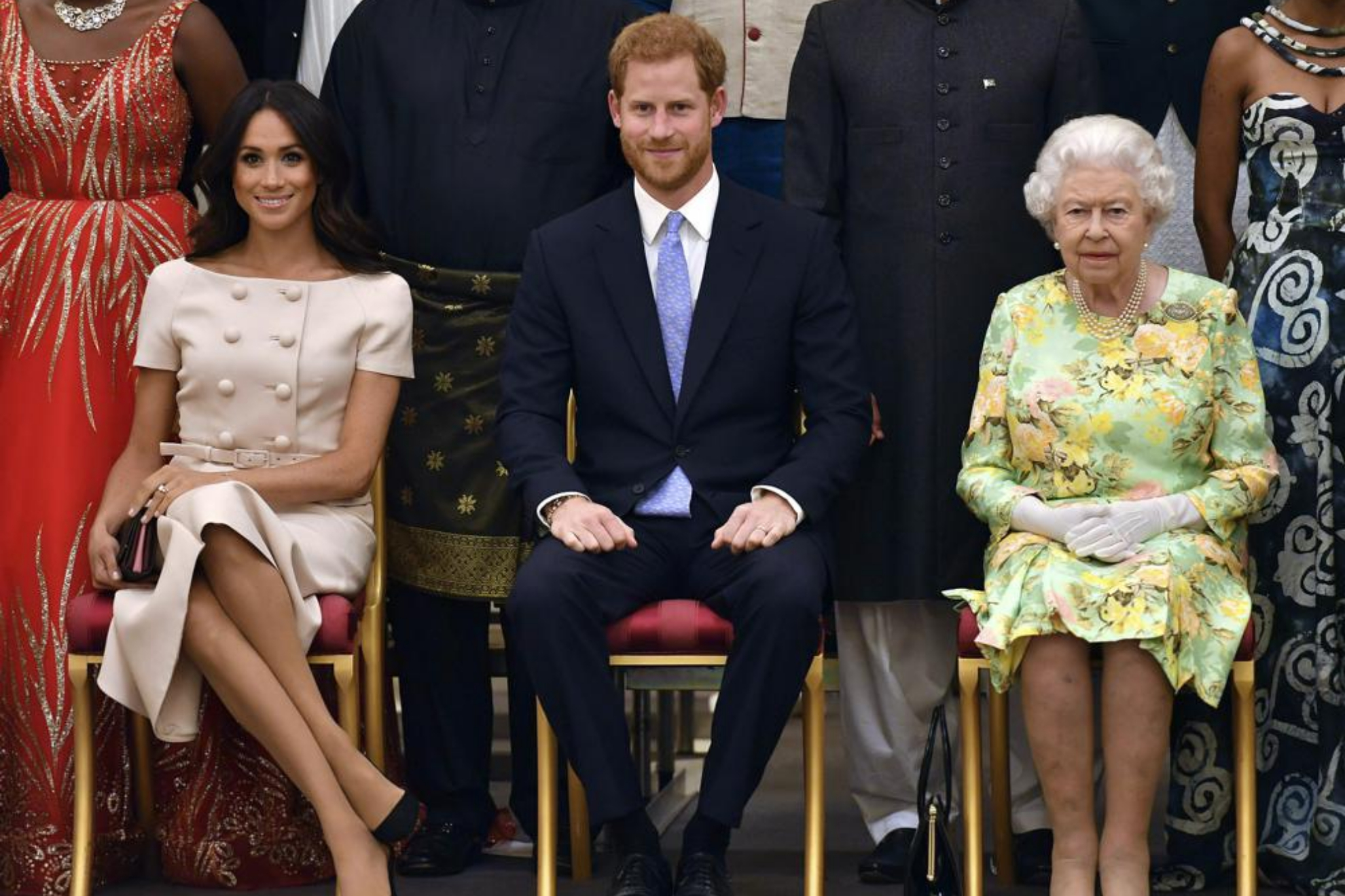 Queen Elizabeth II, Prince Harry and Meghan Markle. - John Stillwell/Pool Photo via AP