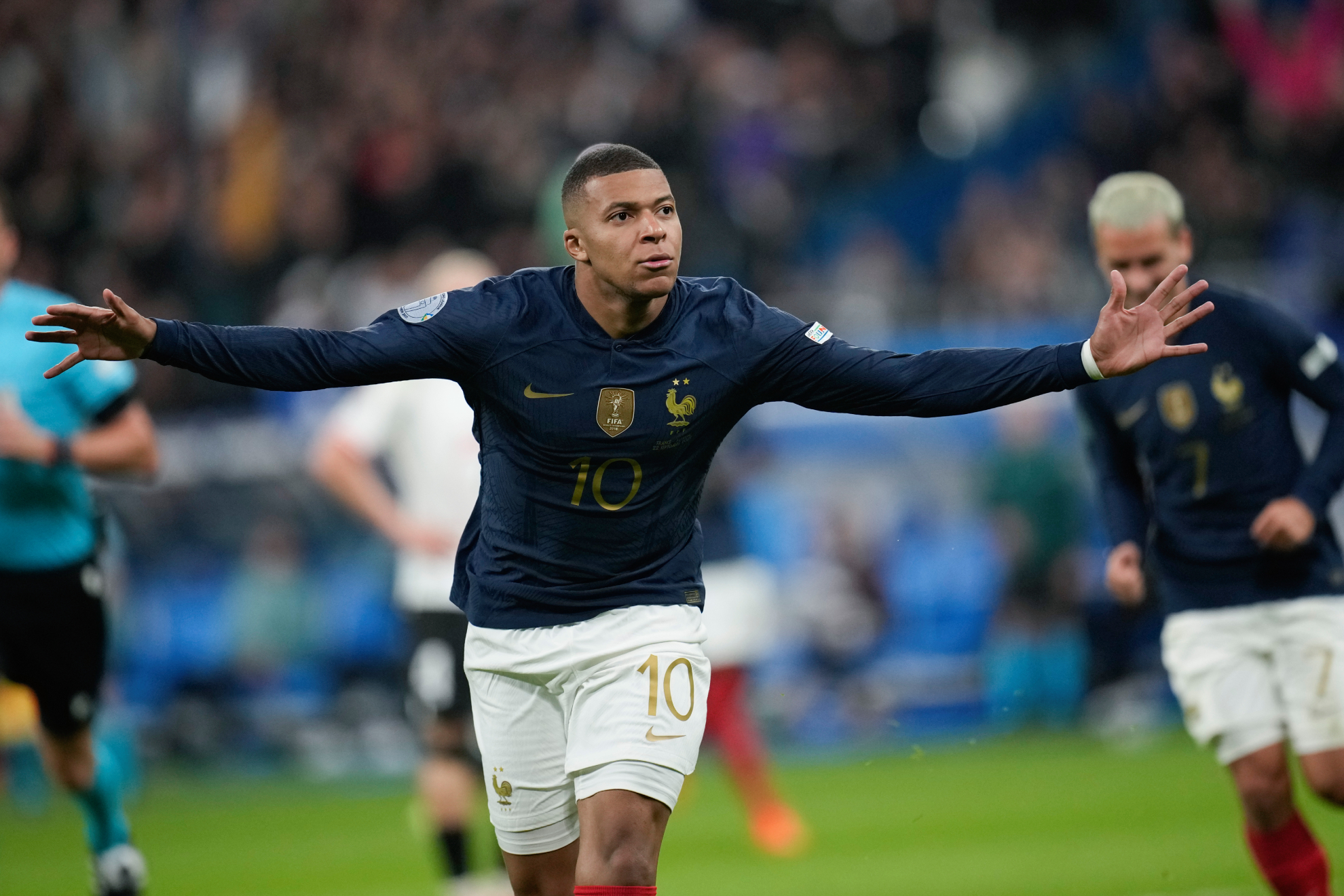 France's Kylian Mbappe celebrates scoring his side's first goal during the UEFA Nations League soccer match between France and Austria.