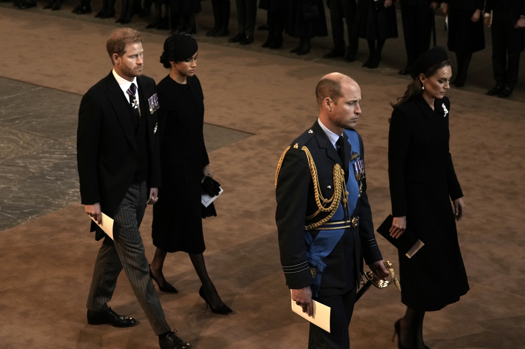 Prince Harry, Meghan, Prince William and Kate, Princess of Wales, leave Westminster Hall in London