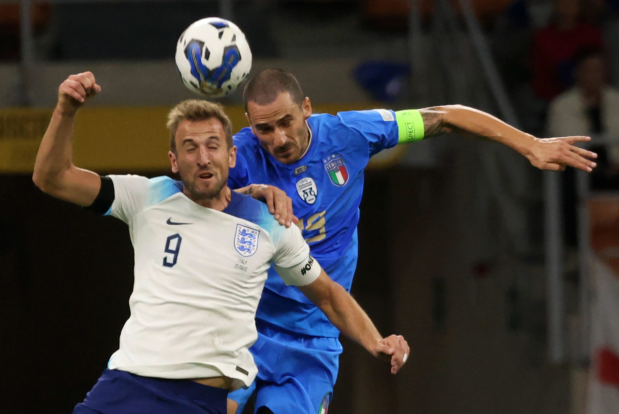 England's Harry Kane (L) in action against Italy's Leonardo Bonucci 