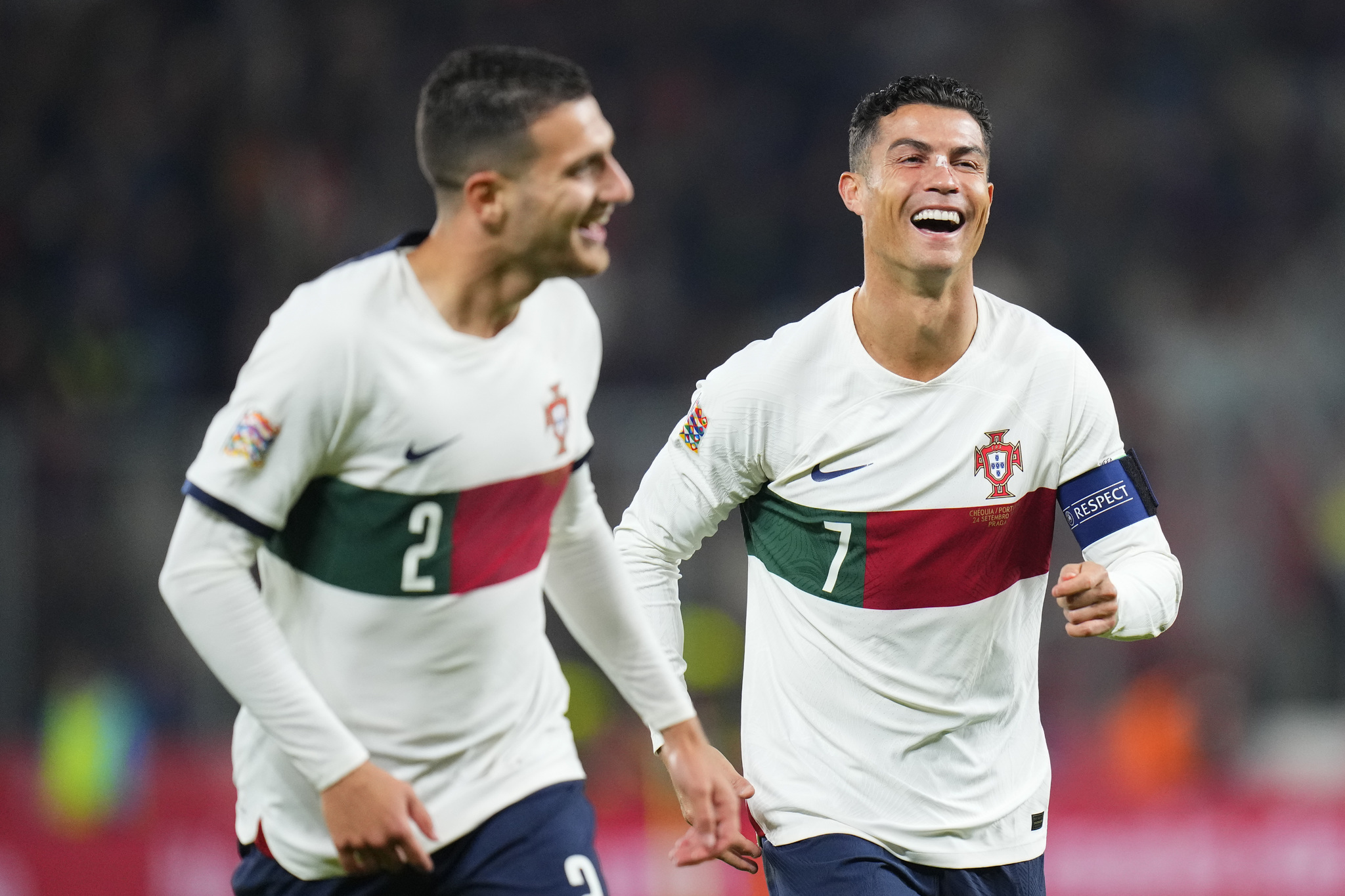 Portugal's Diogo Dalot, who scored his side's third goal, celebrates with Cristiano Ronaldo