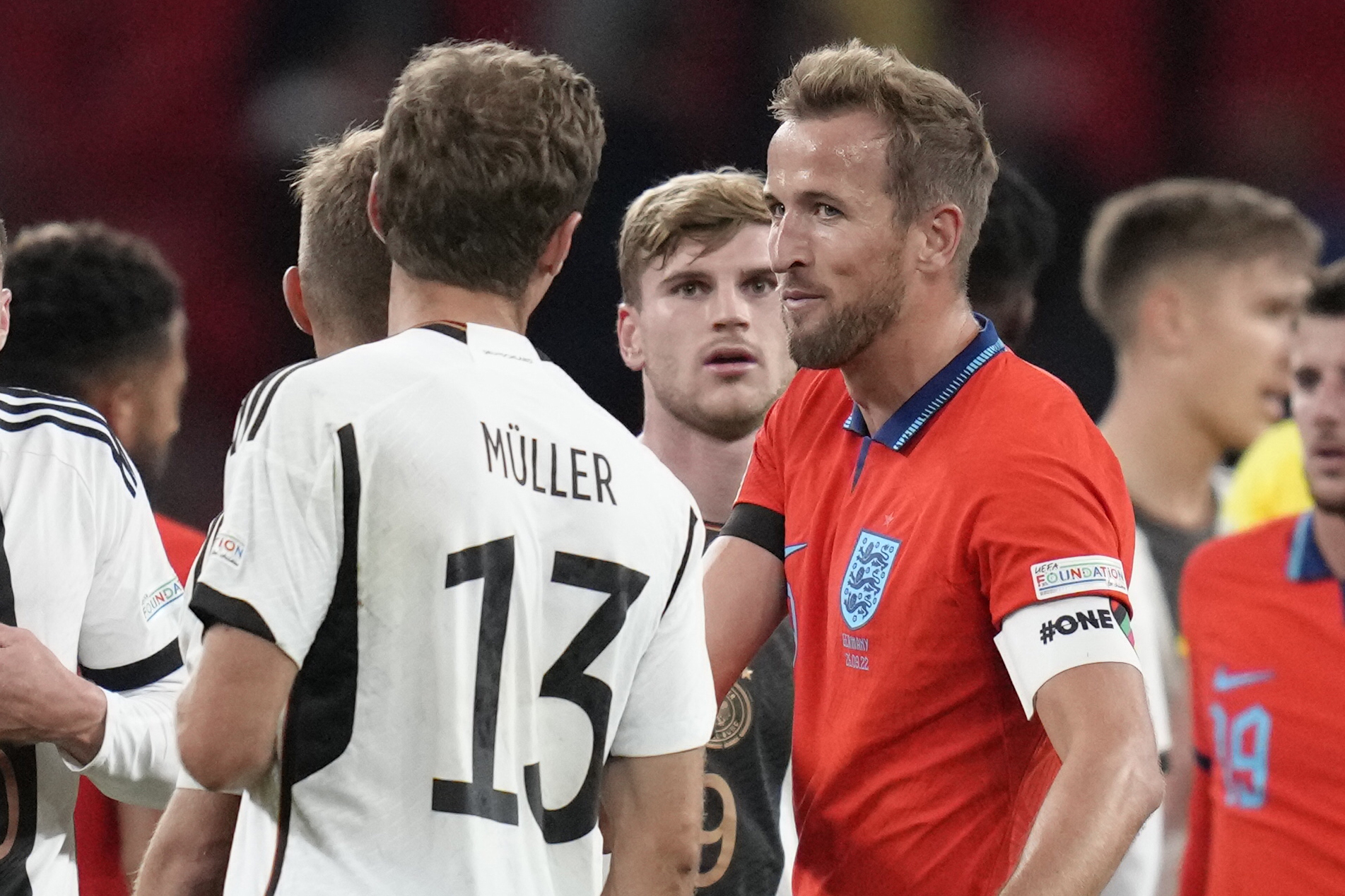 Muller and Kane joke after the match.