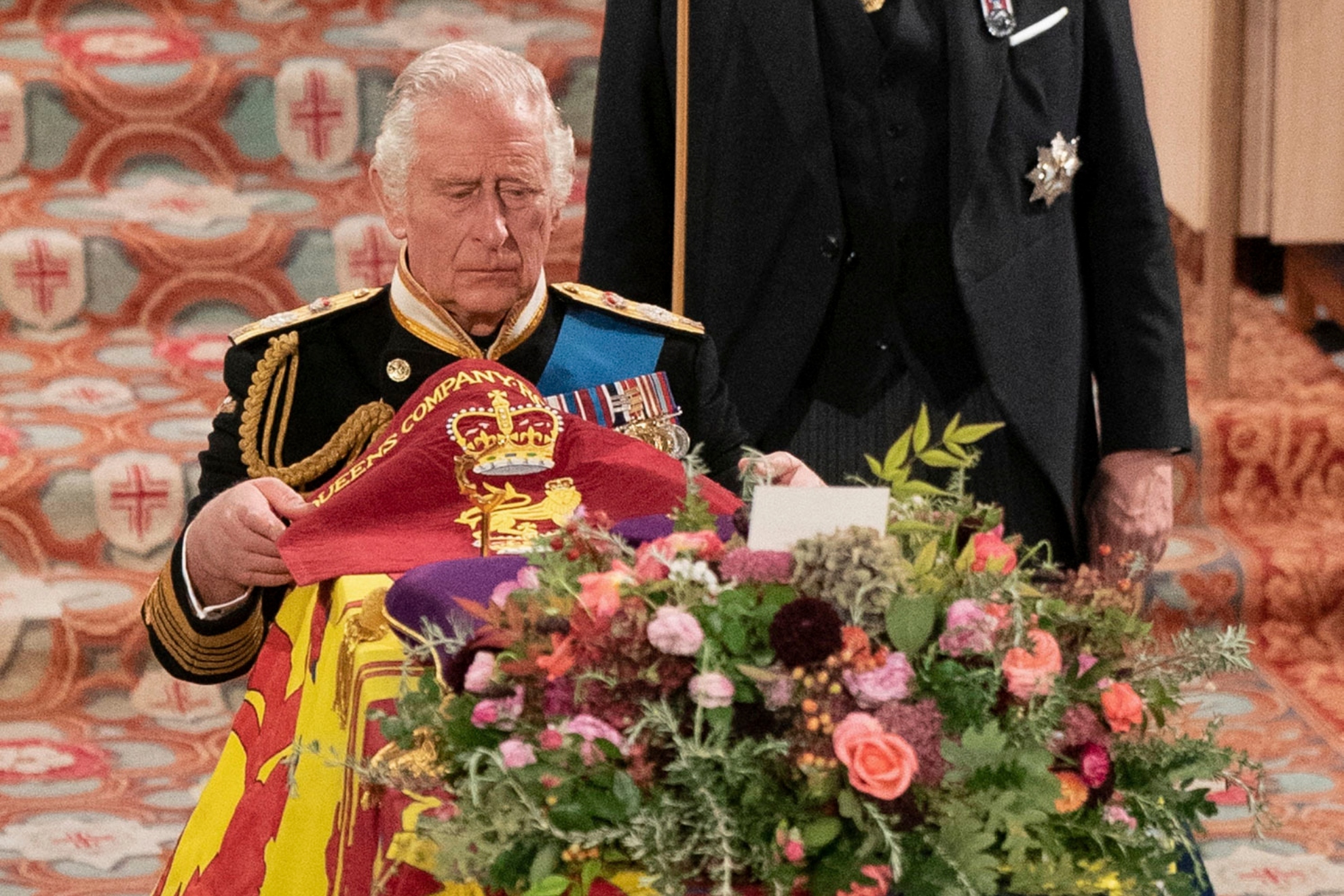 King Charles III places the Queen's Company Camp Colour of the Grenadier Guards during a committal service for Britain's Queen Elizabeth II at St George's Chapel, Windsor Castle, in Windsor, England, Monday, Sept. 19, 2022 / AP