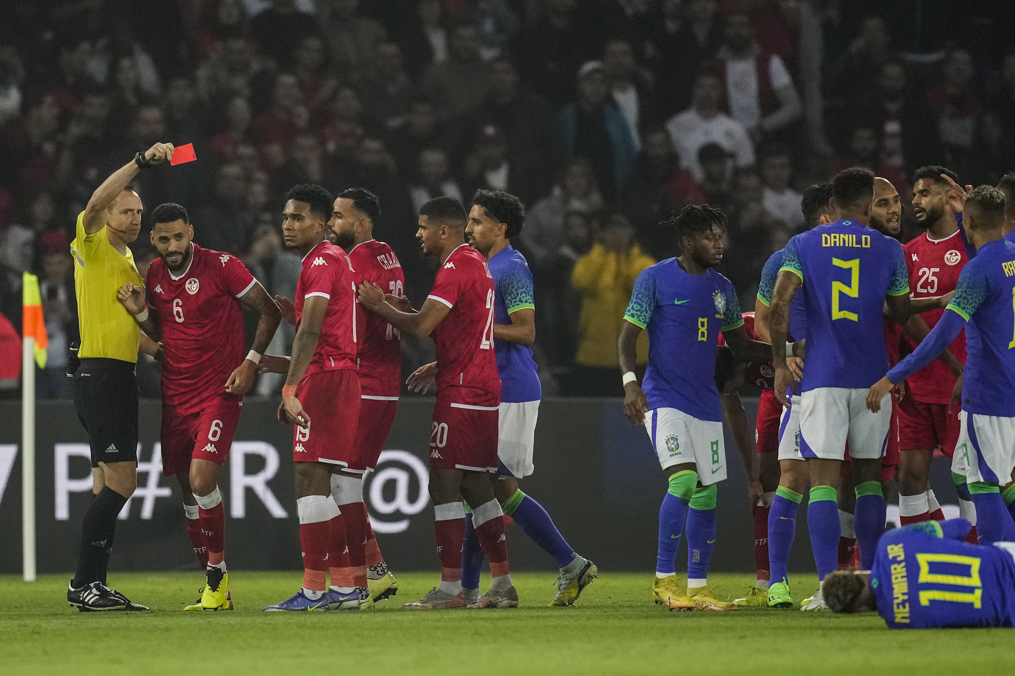 Tunisia's Dylan Bronn, second left, receives a red card