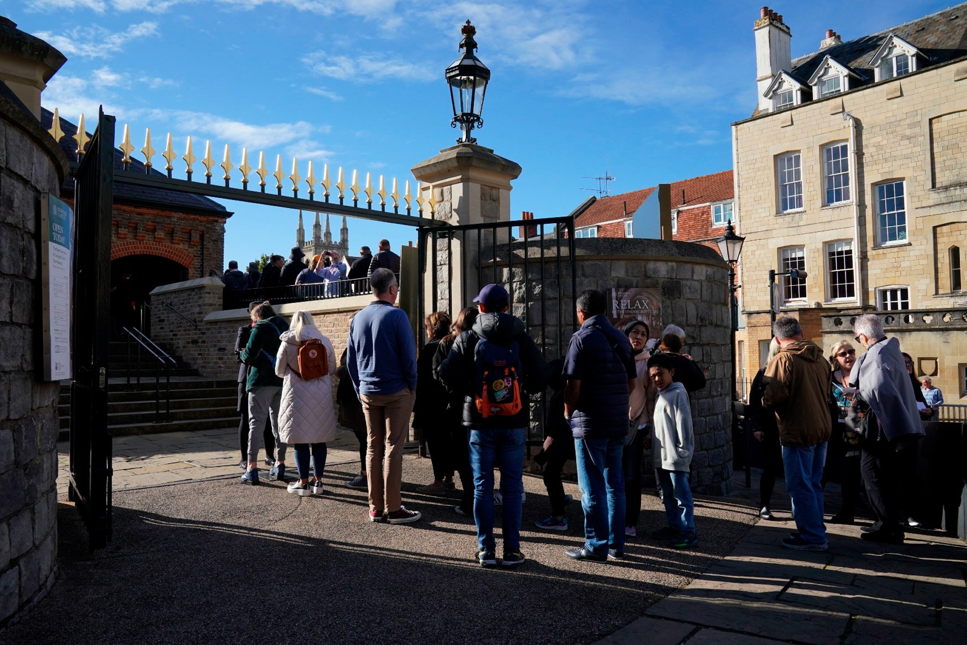 People queue outside as Windsor Castle and St George's Chapel. / AP