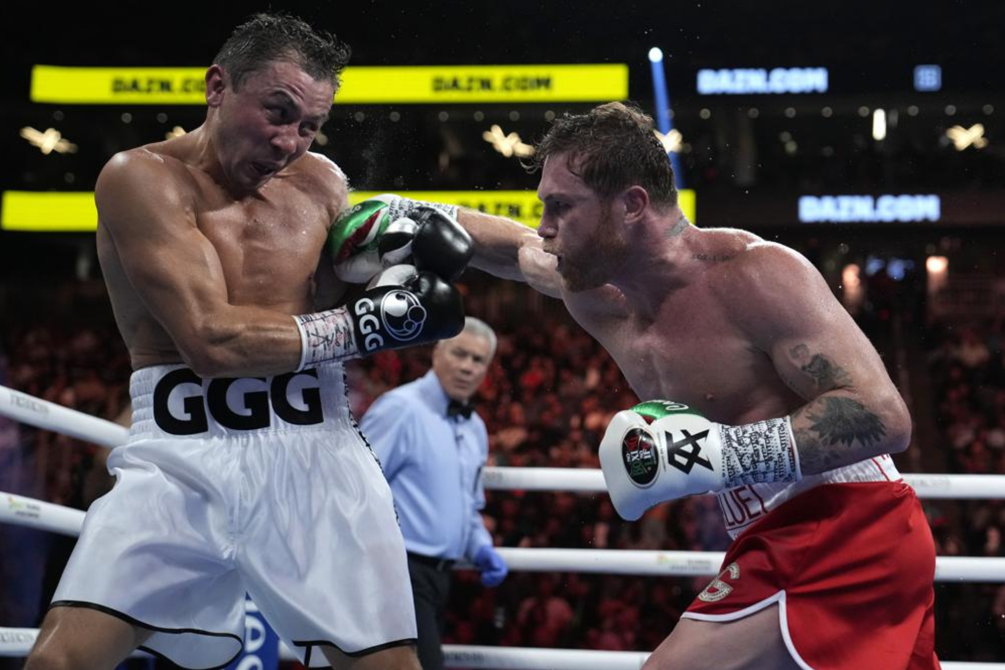 Gennady Golovkin and Canelo Alvarez during their most recent fight. - AP Photo/John Locher