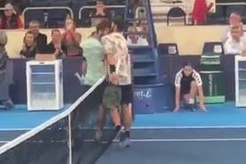 Two tennis players fight at the net after their match: He insulted me!