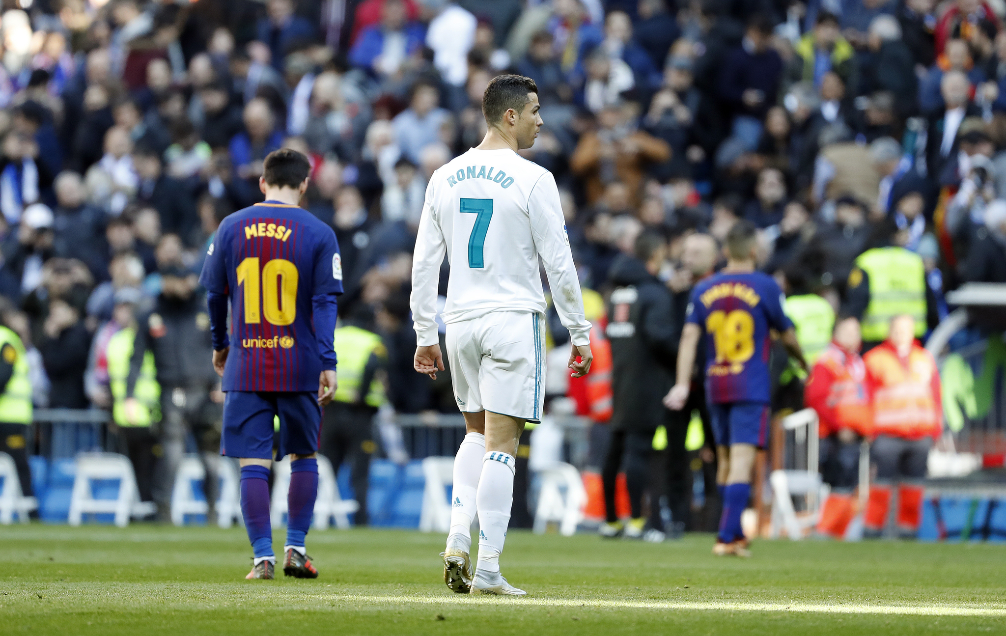 Cristiano Ronaldo and Messi, in a match between Real Madrid and Barcelona.