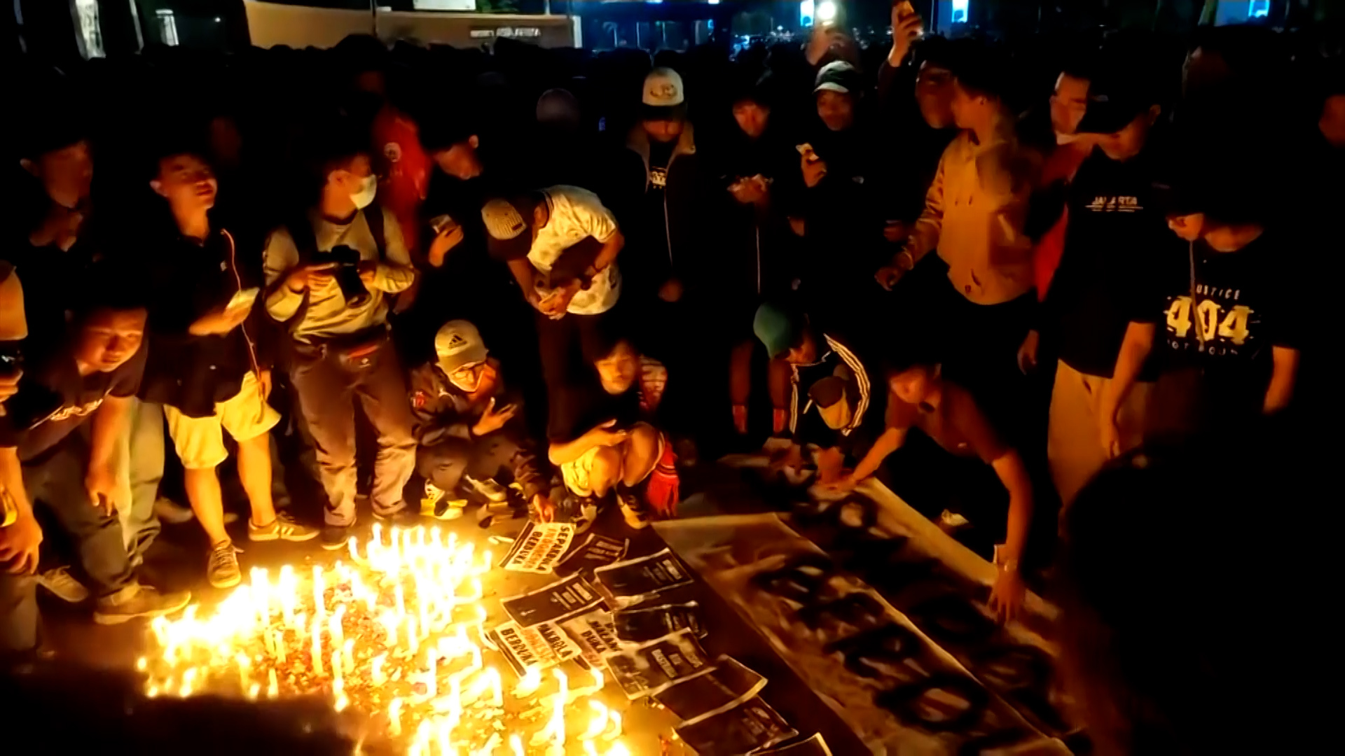 Fans hold vigil in Jakarta after stadium tragedy