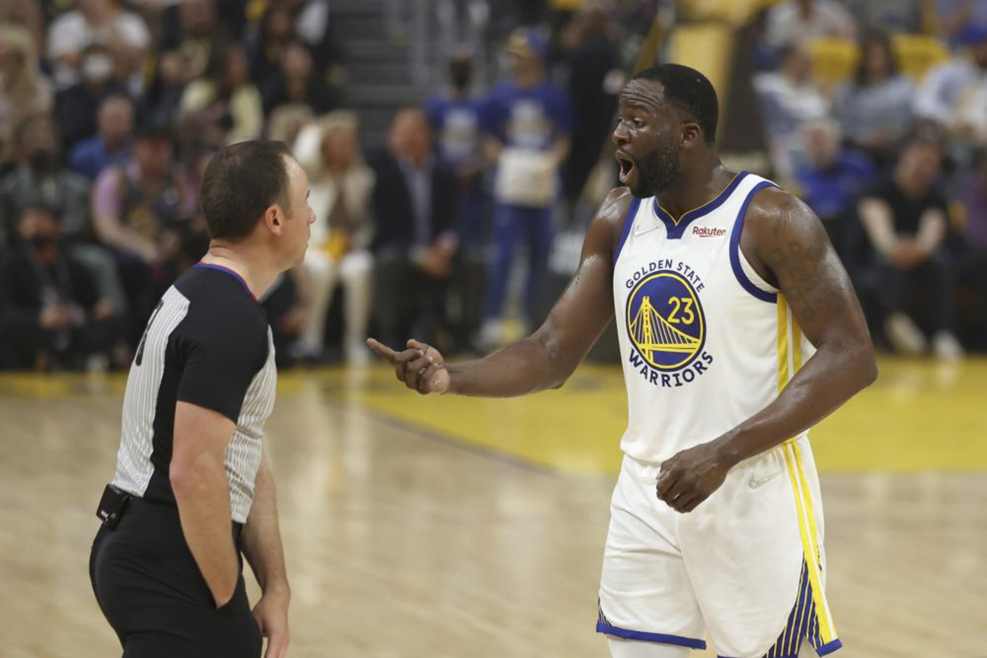 Draymond Green arguing with the referee of an NBA game. - AP Photo/Jed Jacobsohn