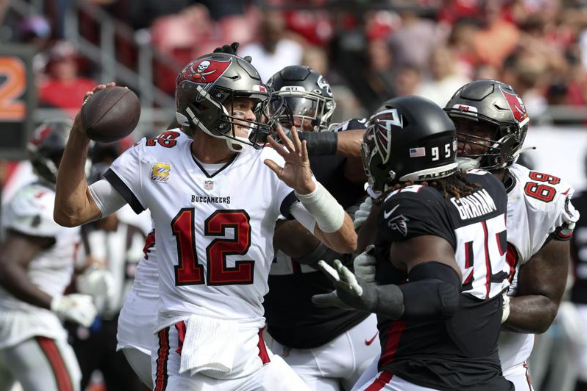Tom Brady being pressured by the Atlanta Falcons defensive front during their Week 5 matchup. - AP Photo/Mark LoMoglio