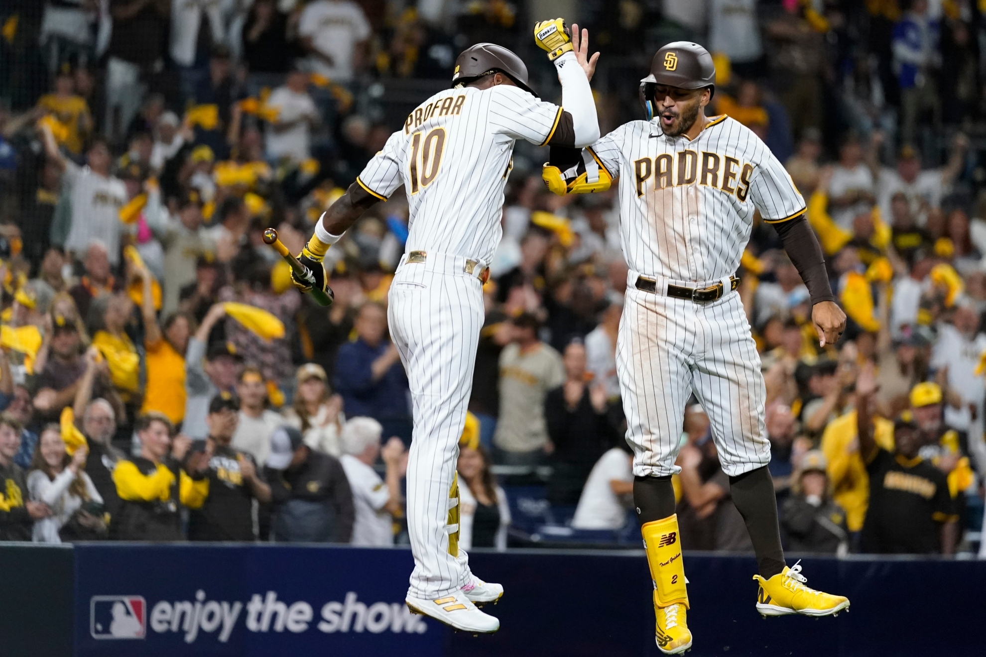 San Diego Padres' Trent Grisham, right, celebrates with teammate Jurickson Profar after hitting a home run during the fourth inning in Game 3 of a baseball NL Division Series against the Los Angeles Dodgers, Friday, Oct. 14, 2022, in San Diego. / AP