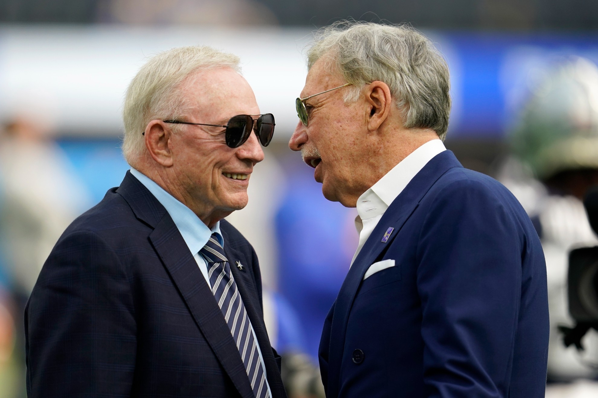 Dallas Cowboys team owner Jerry Jones, left, talks with Stan Kroenke, Los Angeles Rams owner. /AP