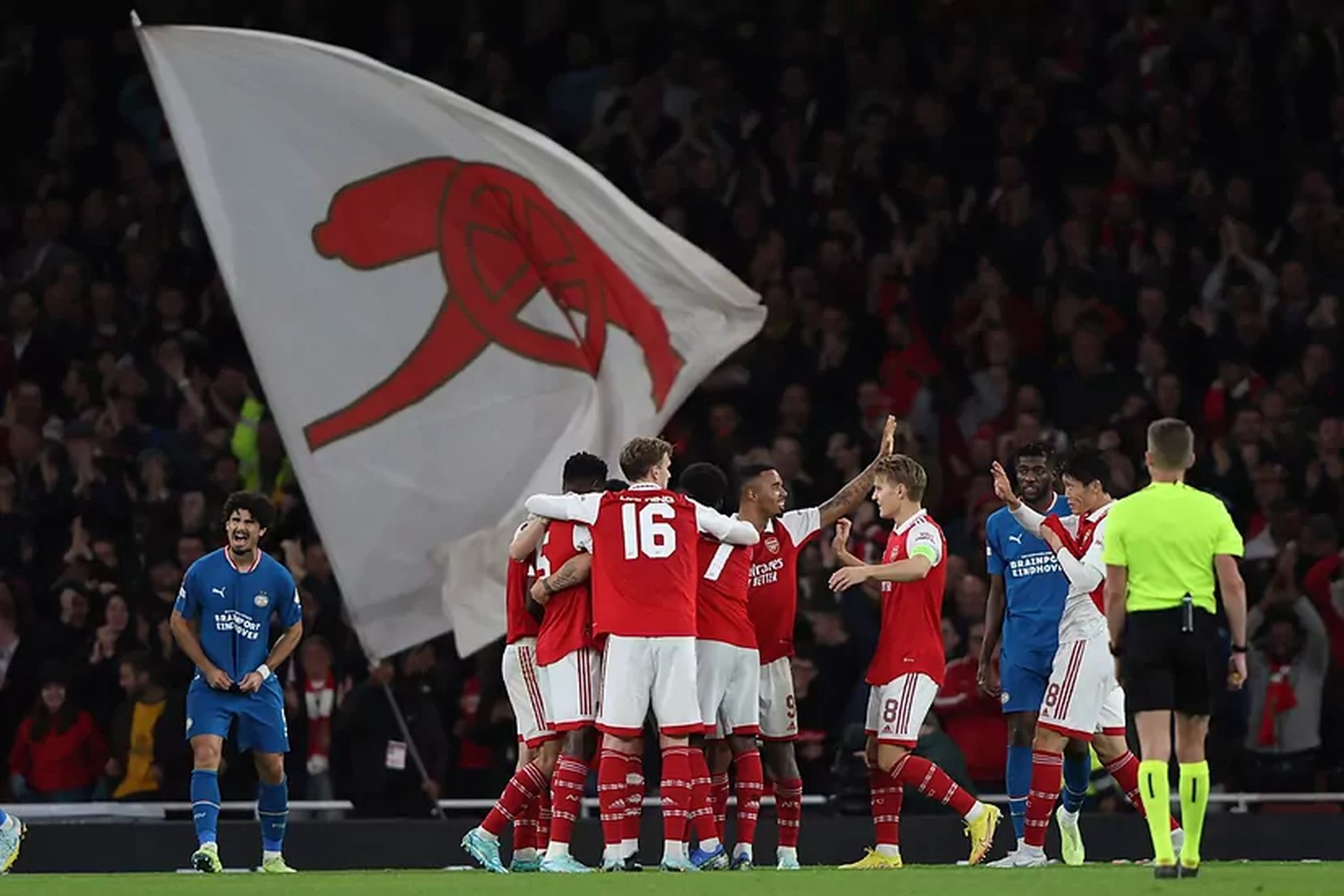 Arsenal celebrate their goal against PSV