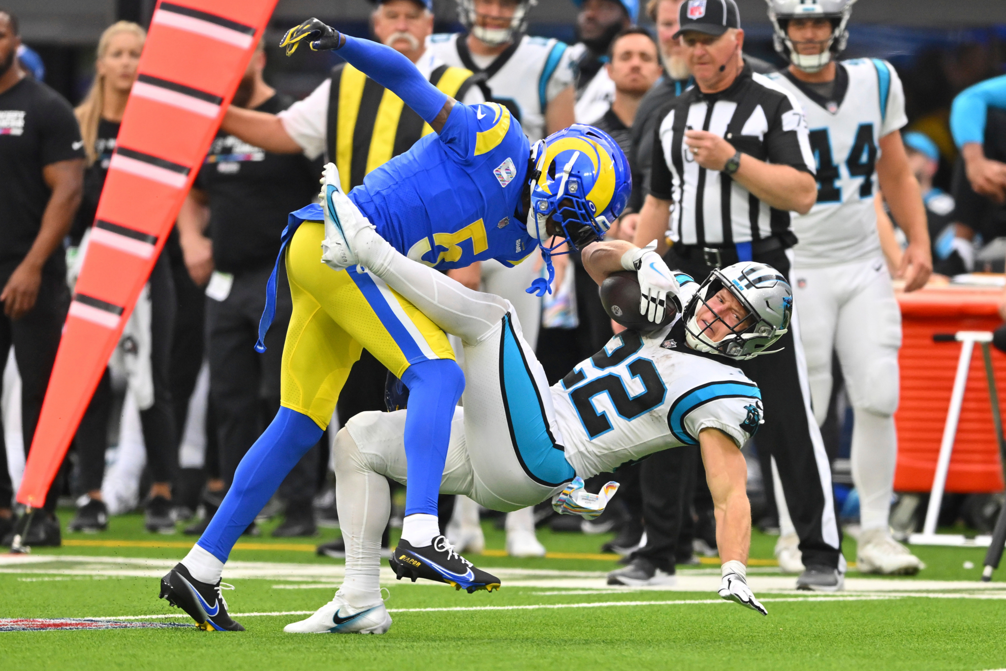 Jalen Ramsey tackles Christian McCaffrey during their most recent game in the NFL.