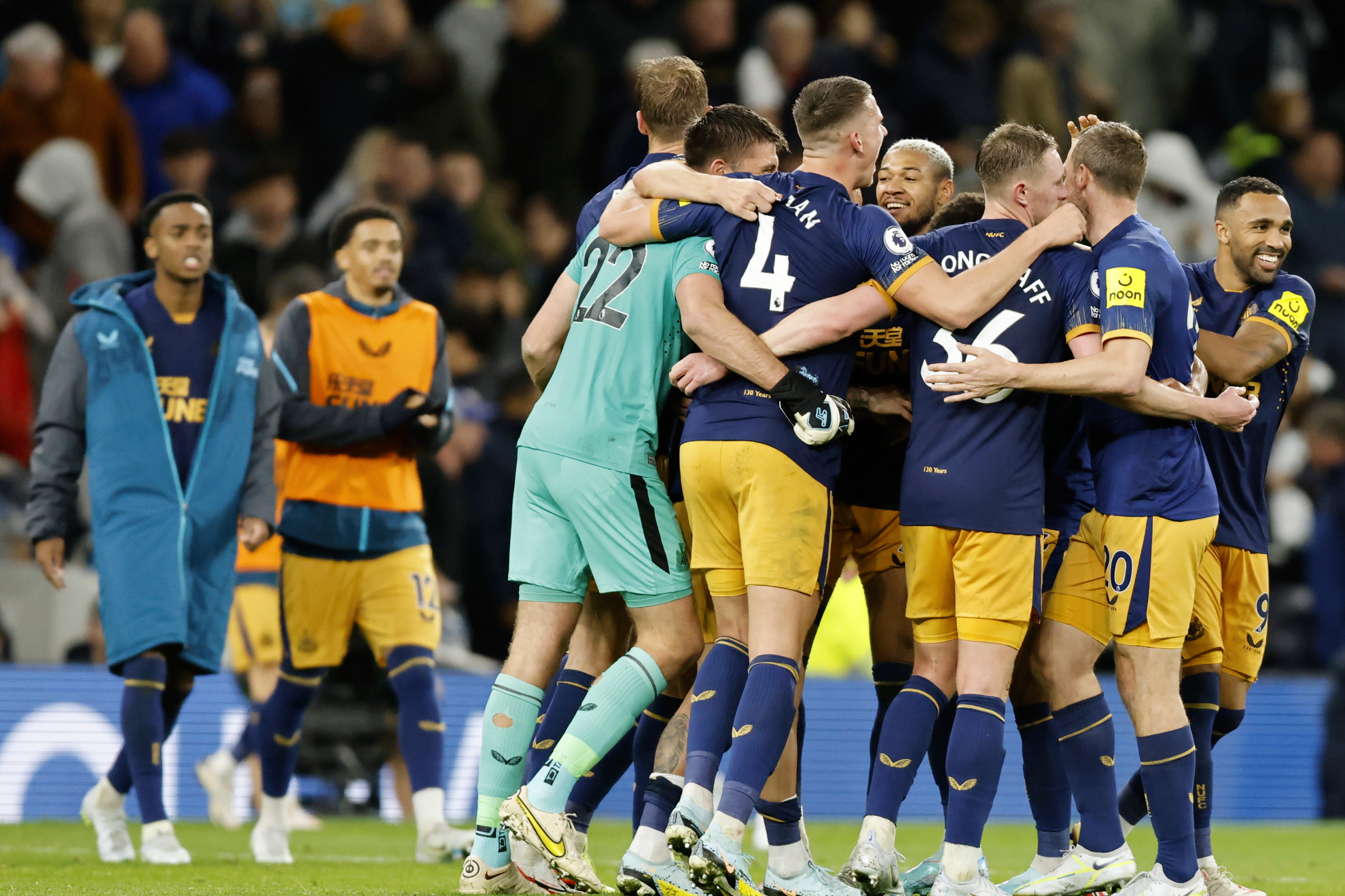 Players of Newcastle celebrate after winning the Premier League soccer match between Tottenham and Newcastle.