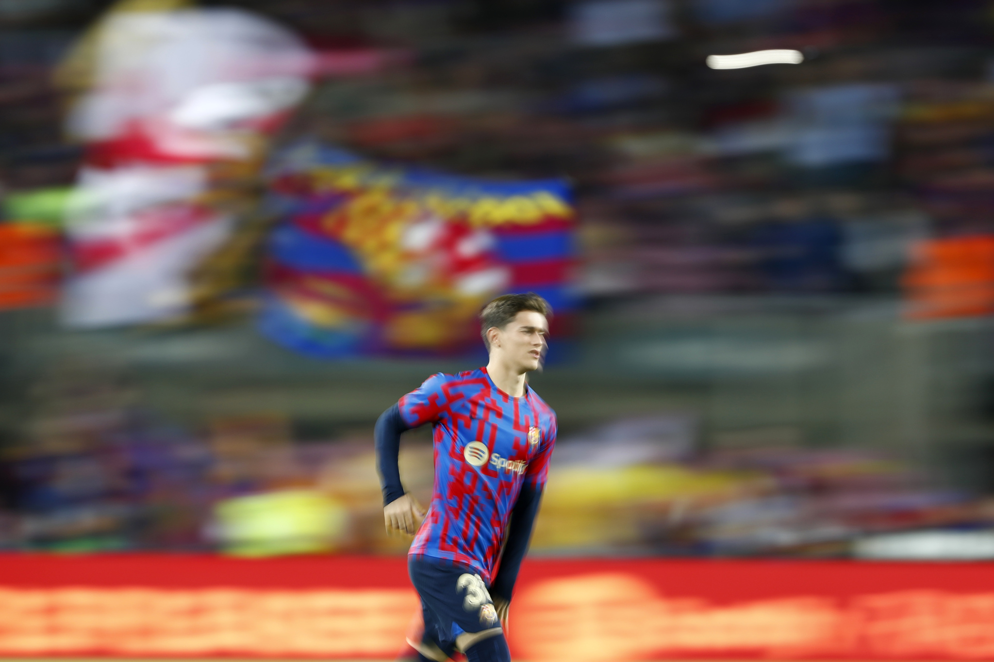In this photo taken with slow shutter speed,  lt;HIT gt;Barcelona lt;/HIT gt;'s Gavi warms up prior to a Spanish La Liga soccer match between  lt;HIT gt;Barcelona lt;/HIT gt; and Athletic Club at the Camp Nou stadium in  lt;HIT gt;Barcelona lt;/HIT gt;, Spain, Sunday, Oct. 23, 2022. (AP Photo/Joan Monfort)