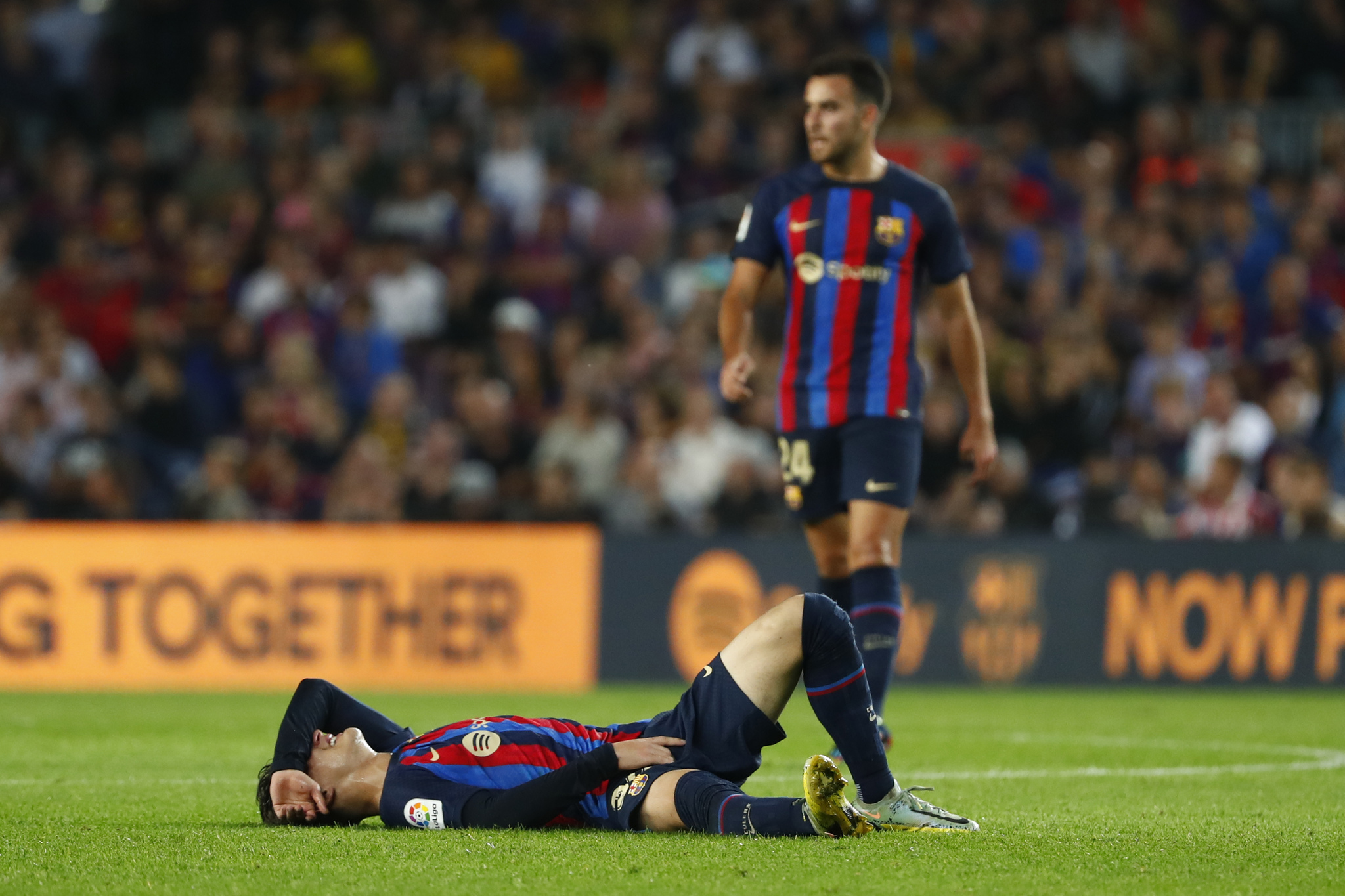 lt;HIT gt;Barcelona lt;/HIT gt;'s Gavi grimaces in pain on the ground during a Spanish La Liga soccer match between  lt;HIT gt;Barcelona lt;/HIT gt; and Athletic Club at the Camp Nou stadium in  lt;HIT gt;Barcelona lt;/HIT gt;, Spain, Sunday, Oct. 23, 2022. (AP Photo/Joan Monfort)