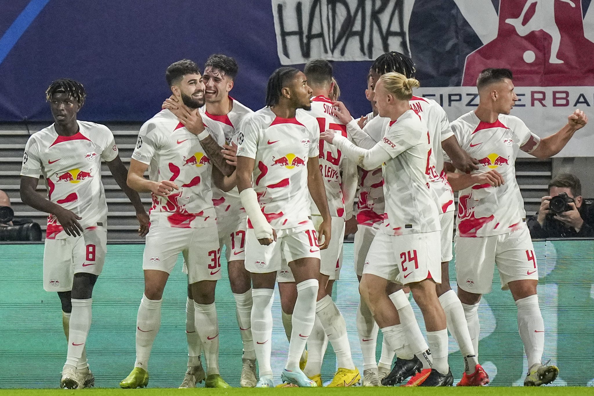 Leipzig's Josko Gvardiol, second left, celebrates after scoring 